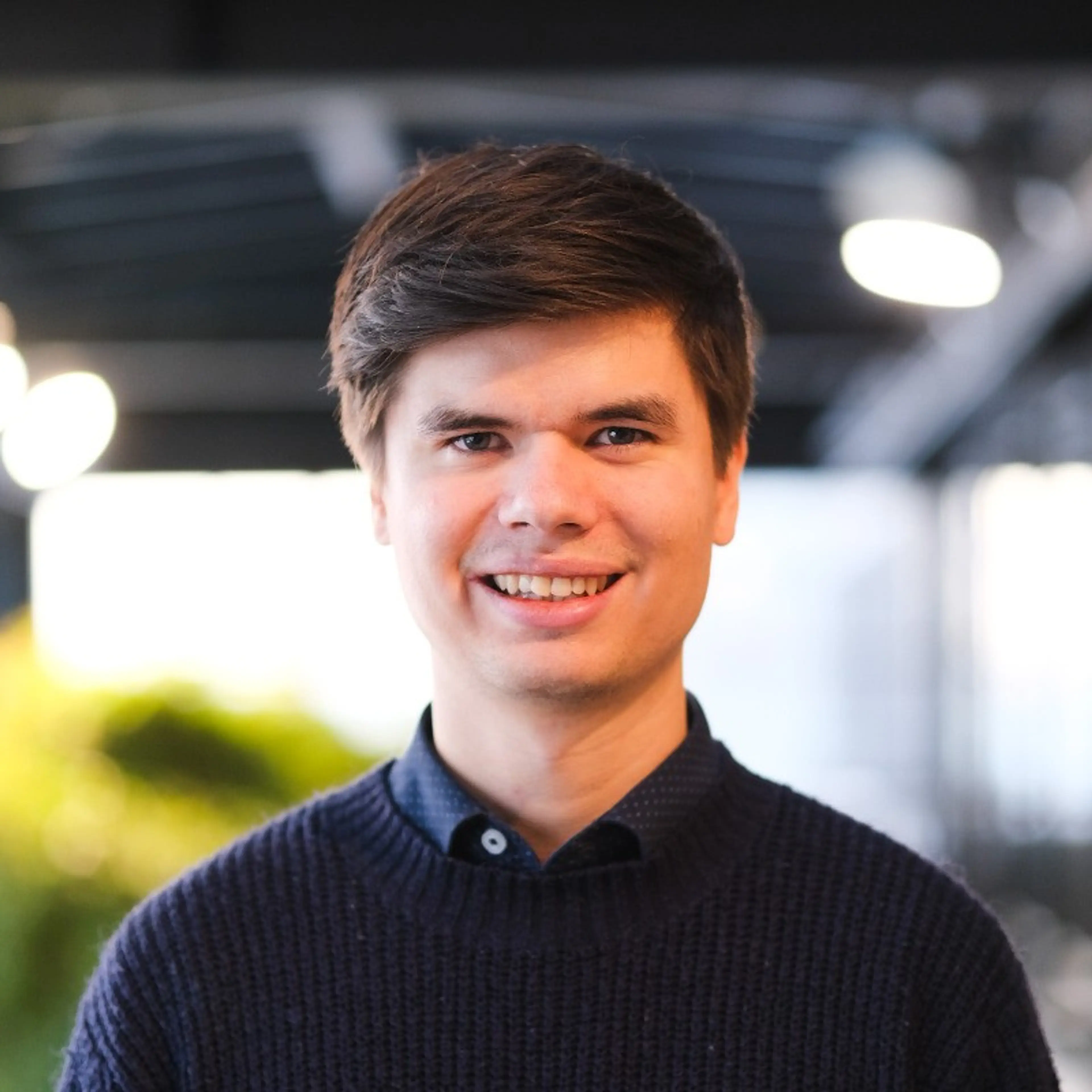 Smiling man with blue shirt