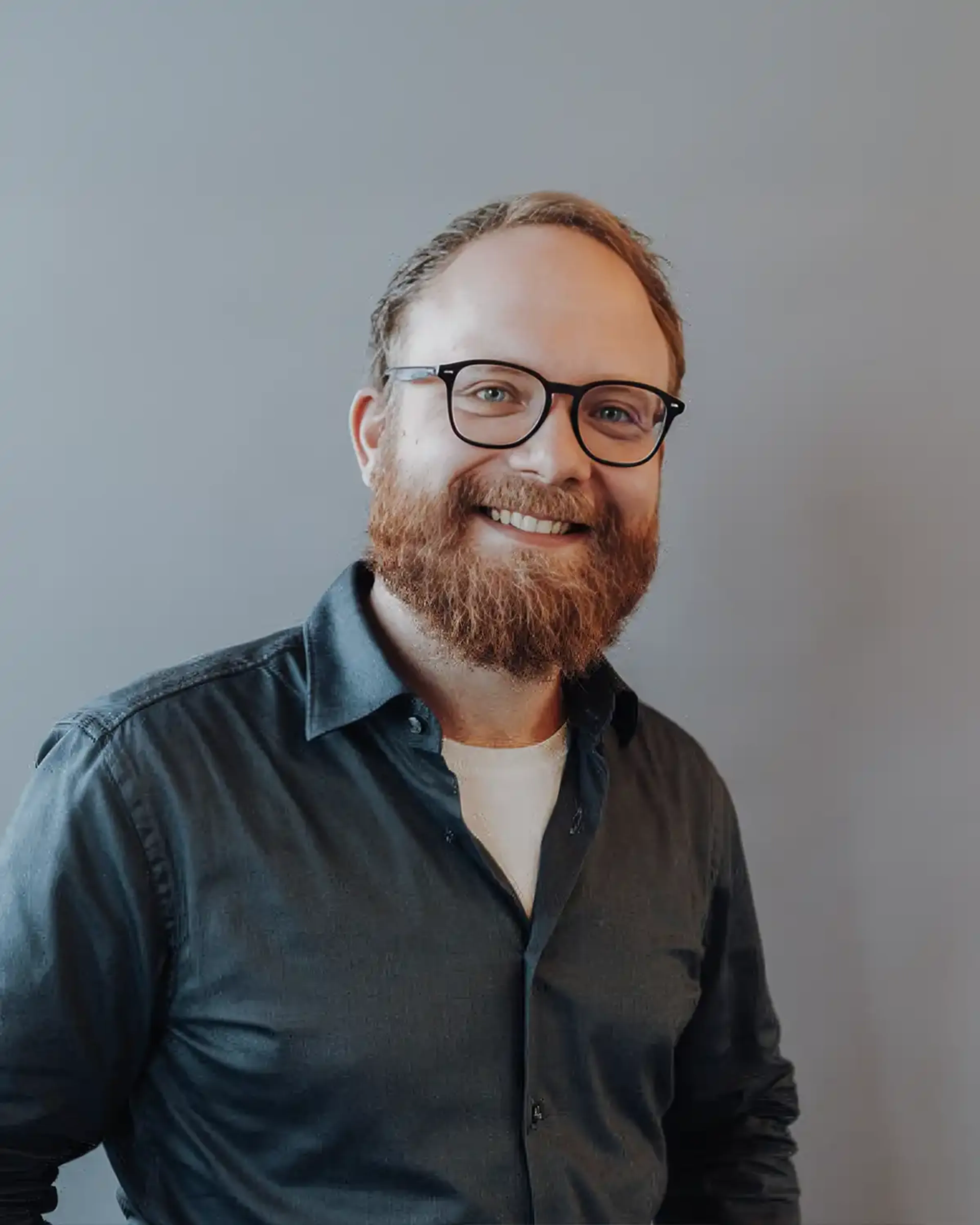 Man with glasses and a green shirt