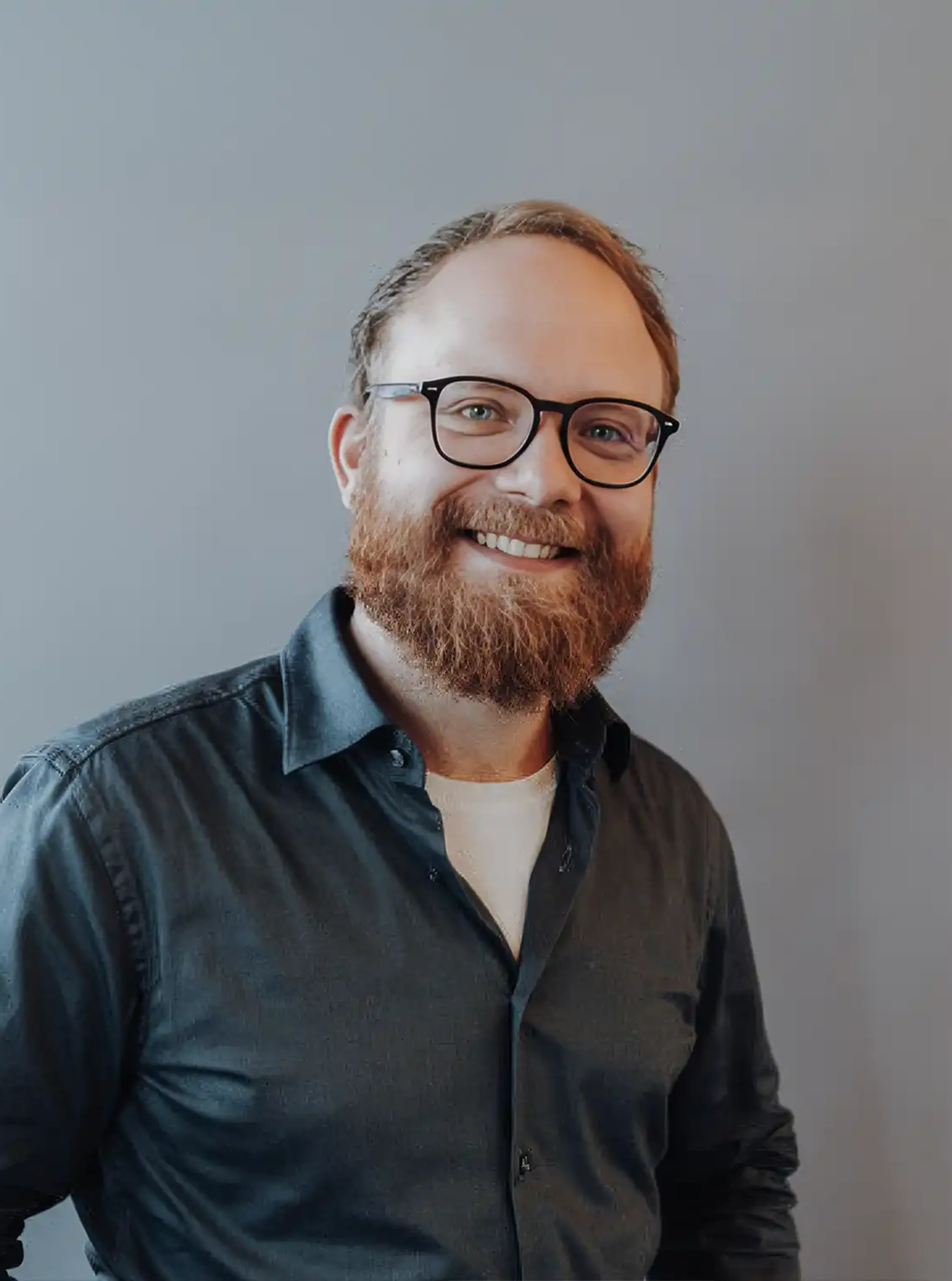Man with glasses and a green shirt