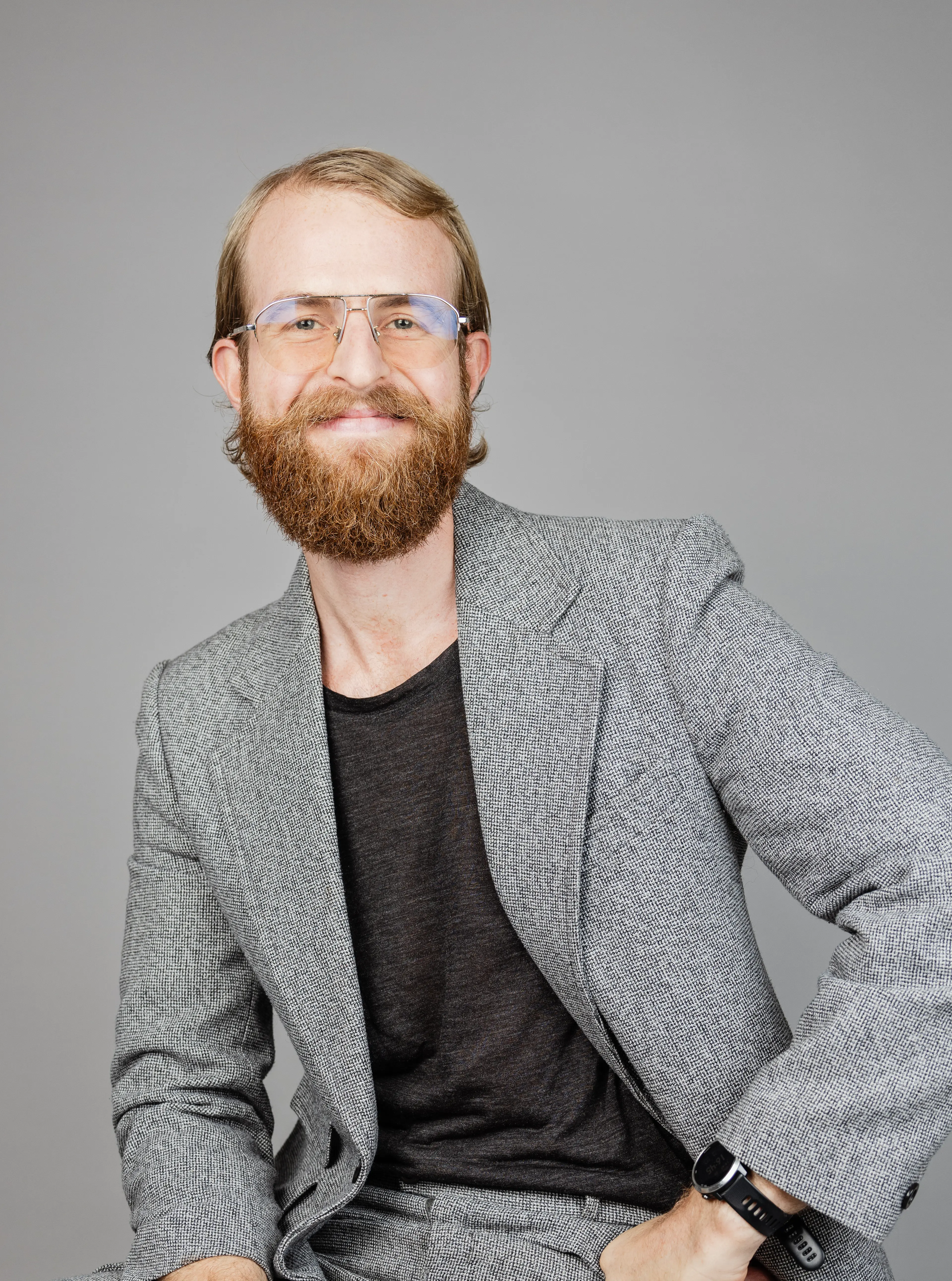 Man with a beard and glasses