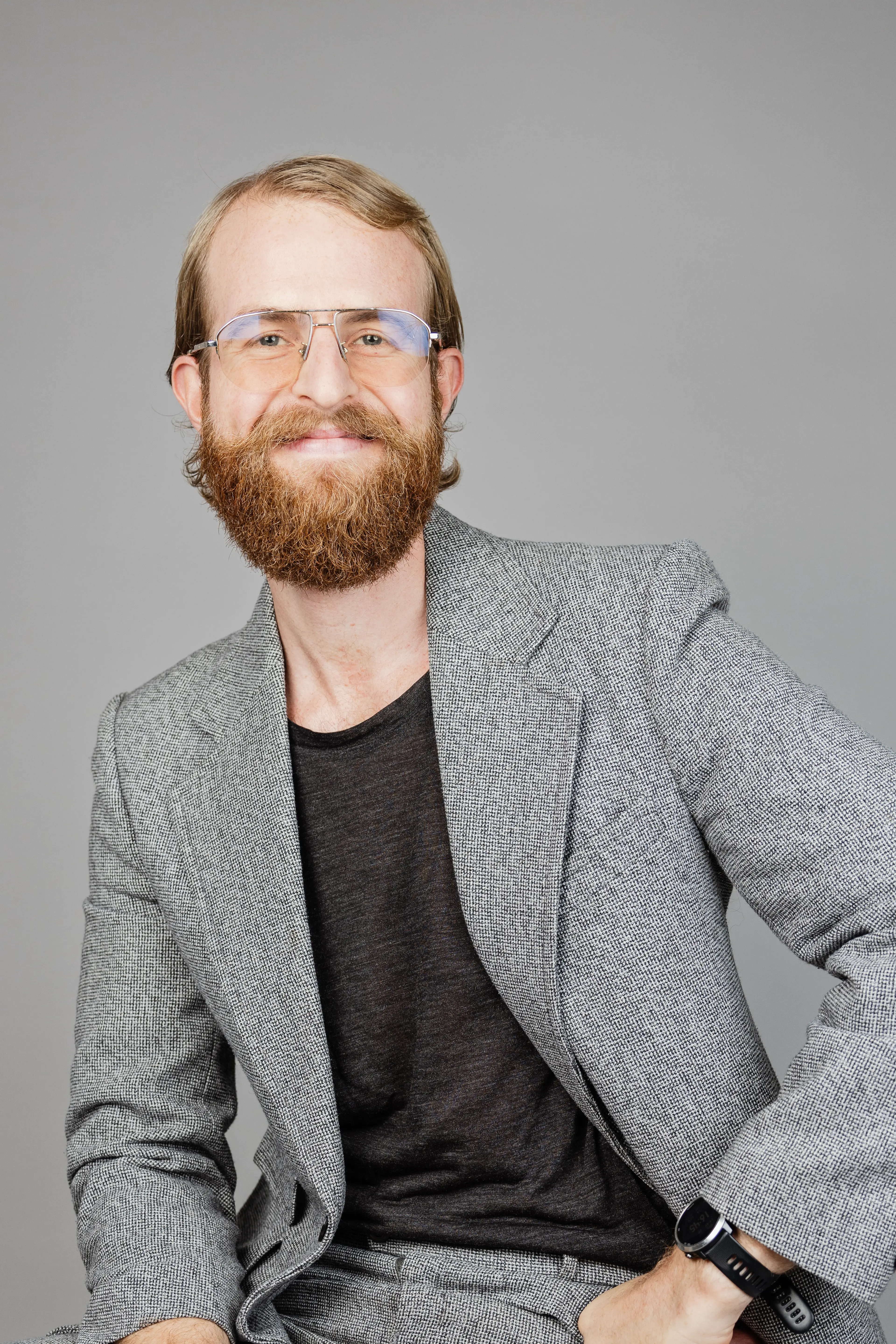 Man with a beard and glasses