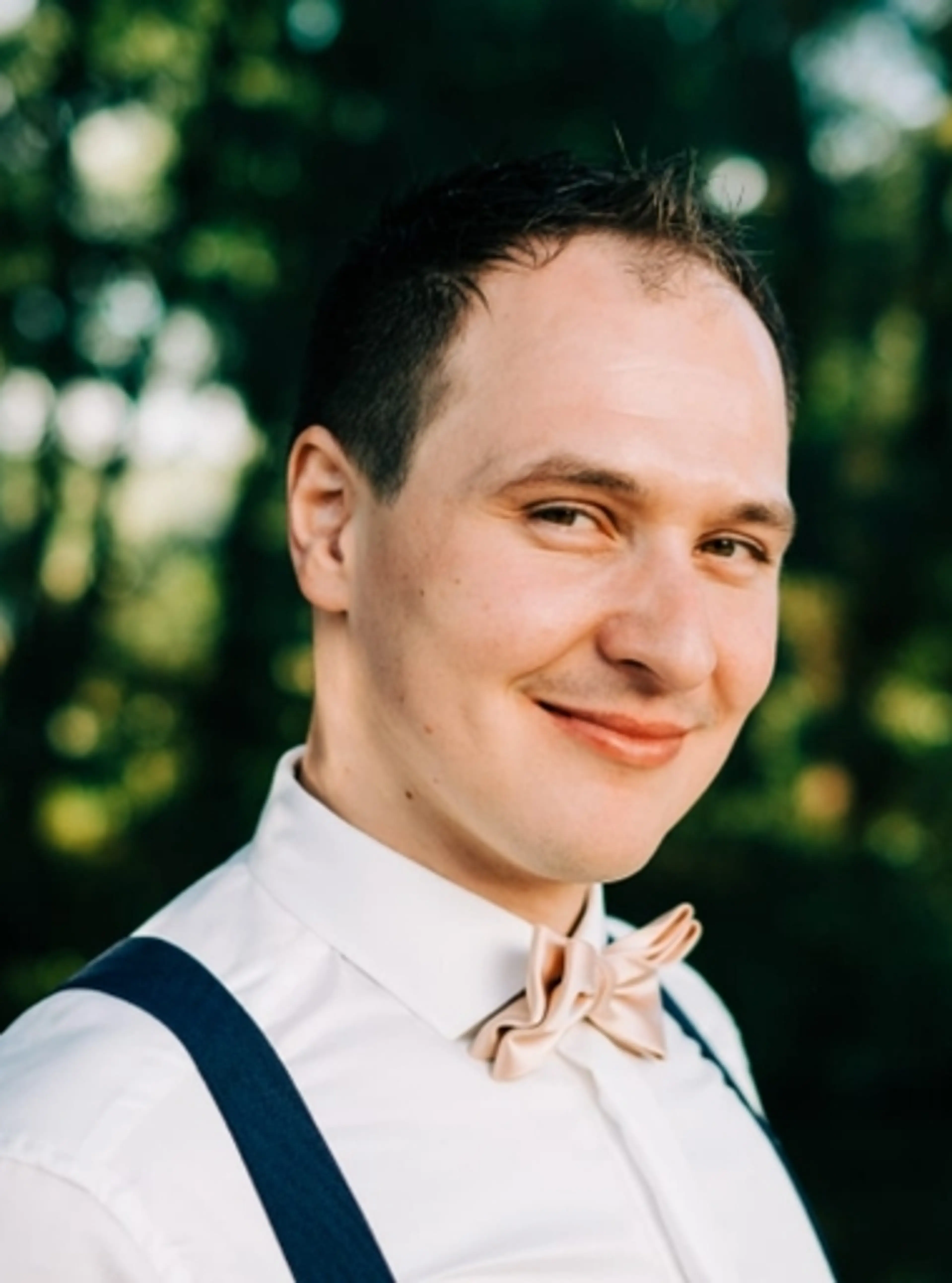 Smiling man with white shirt