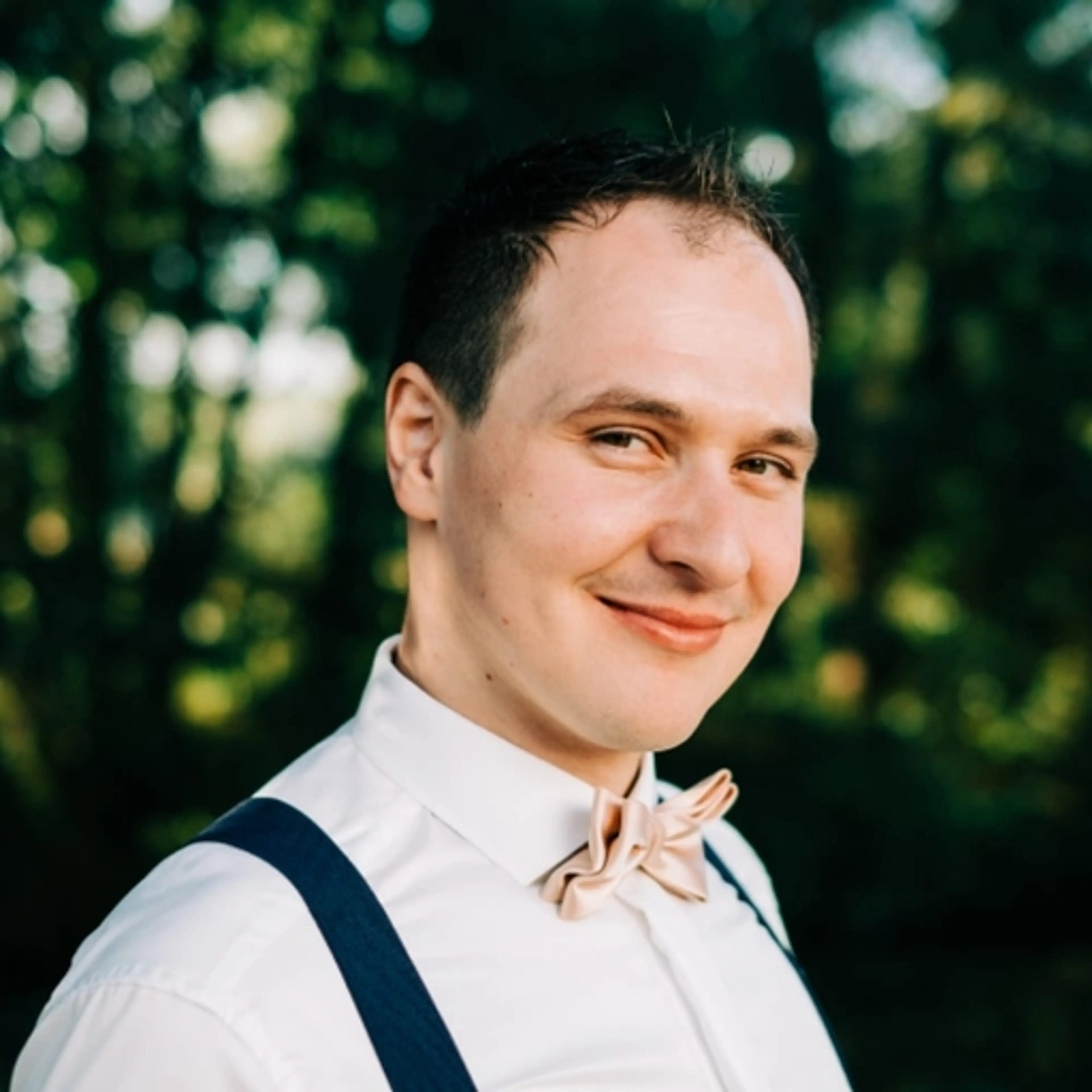 Smiling man with white shirt