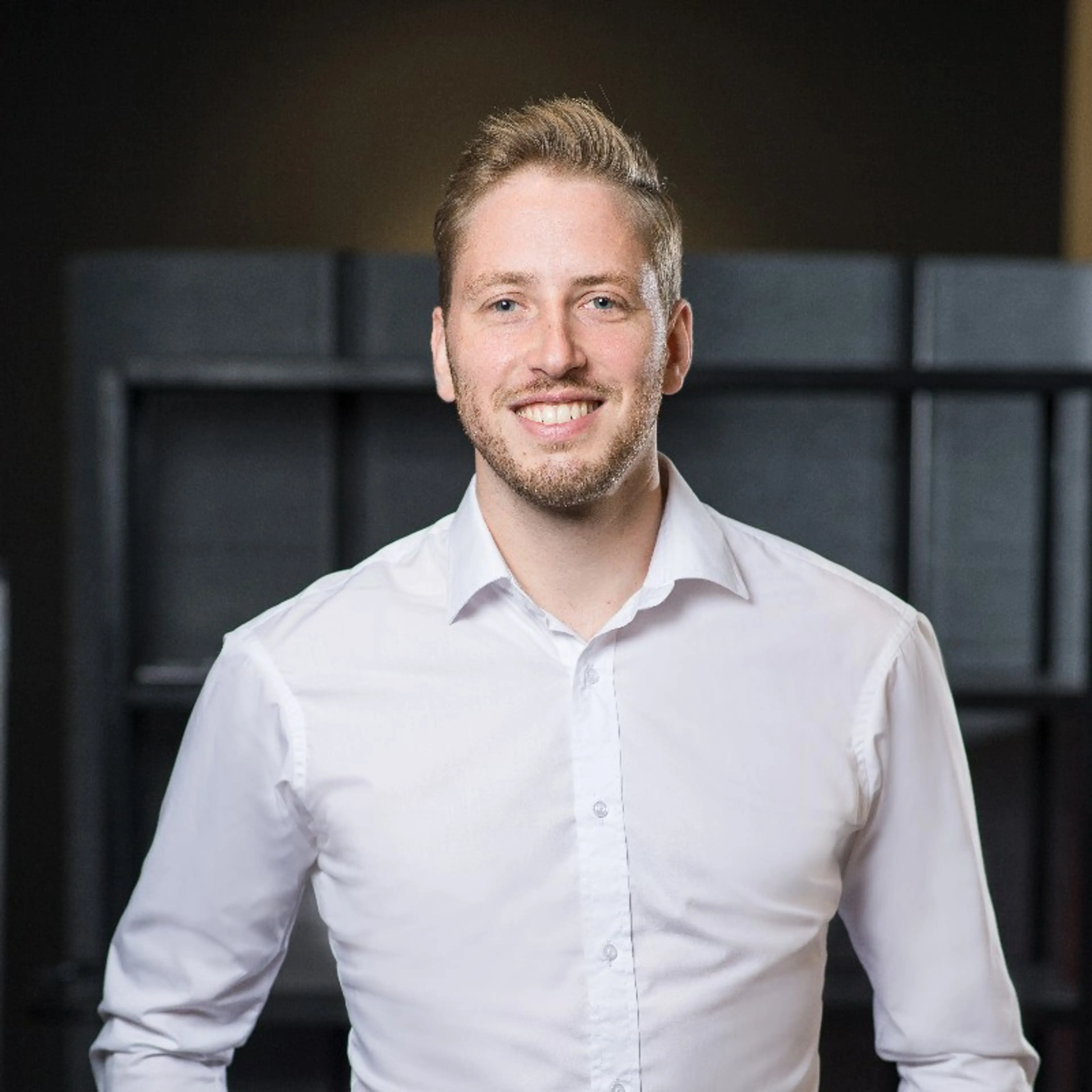 Smiling man with a white shirt