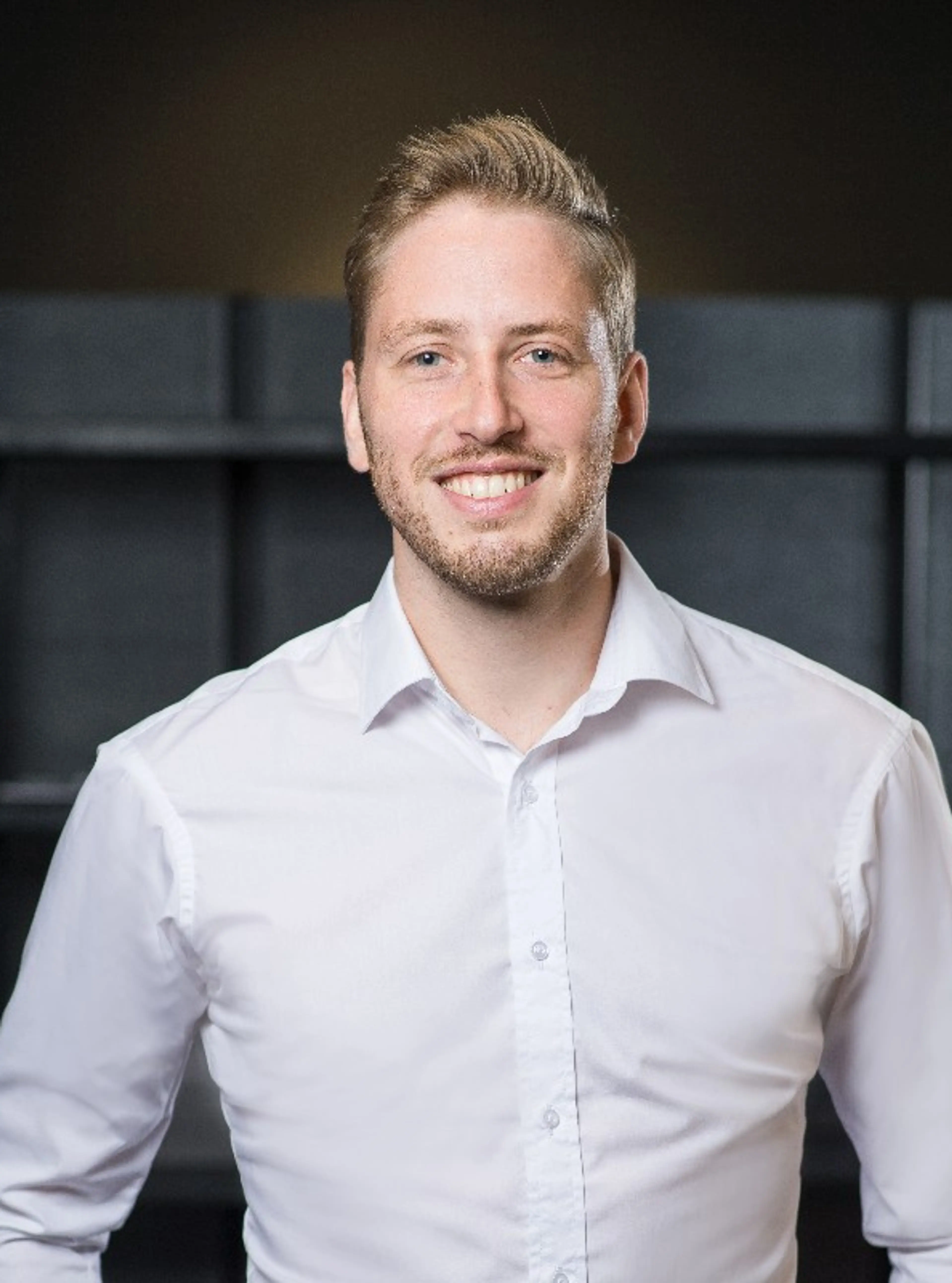 Smiling man with a white shirt