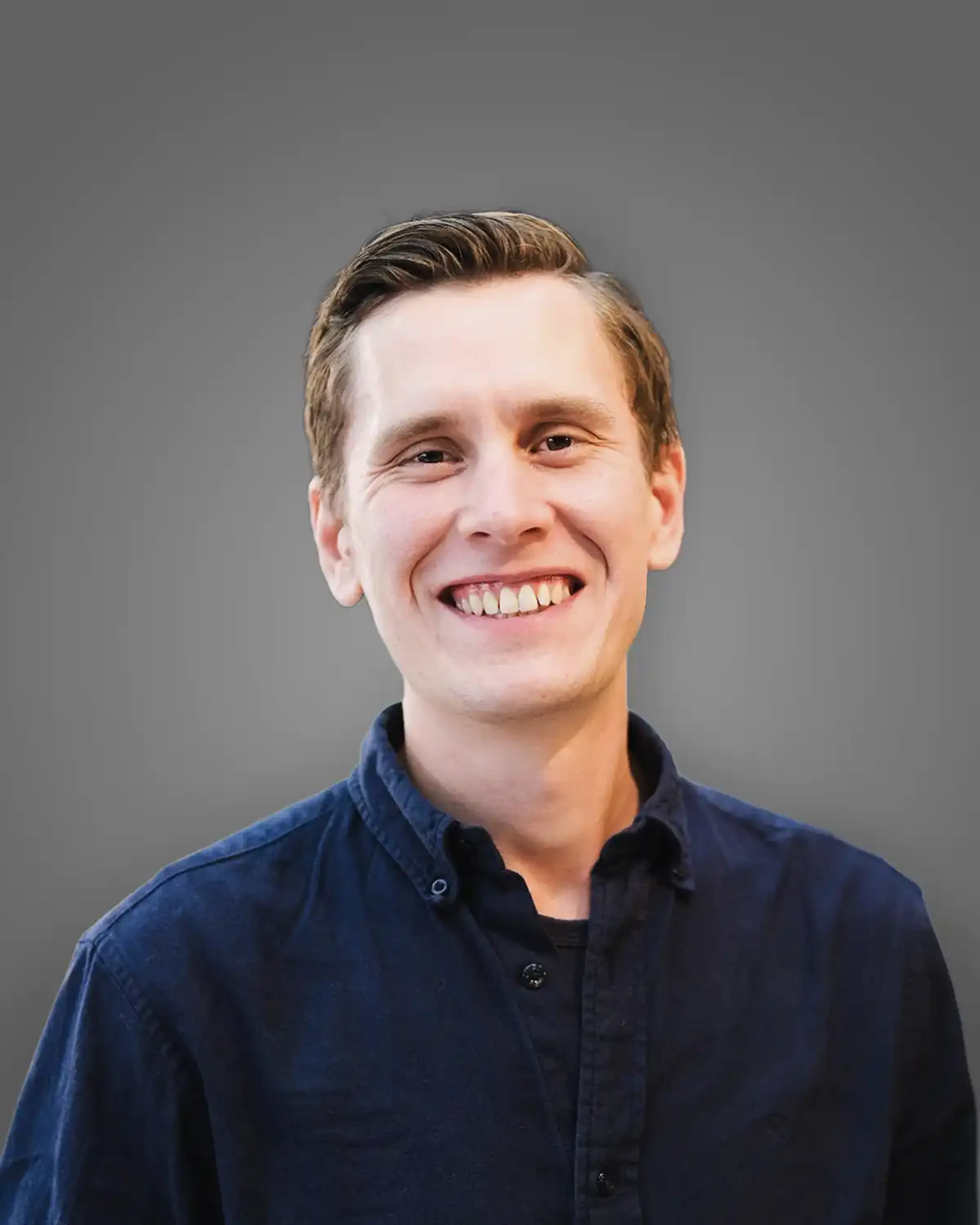 Smiling man with a blue shirt