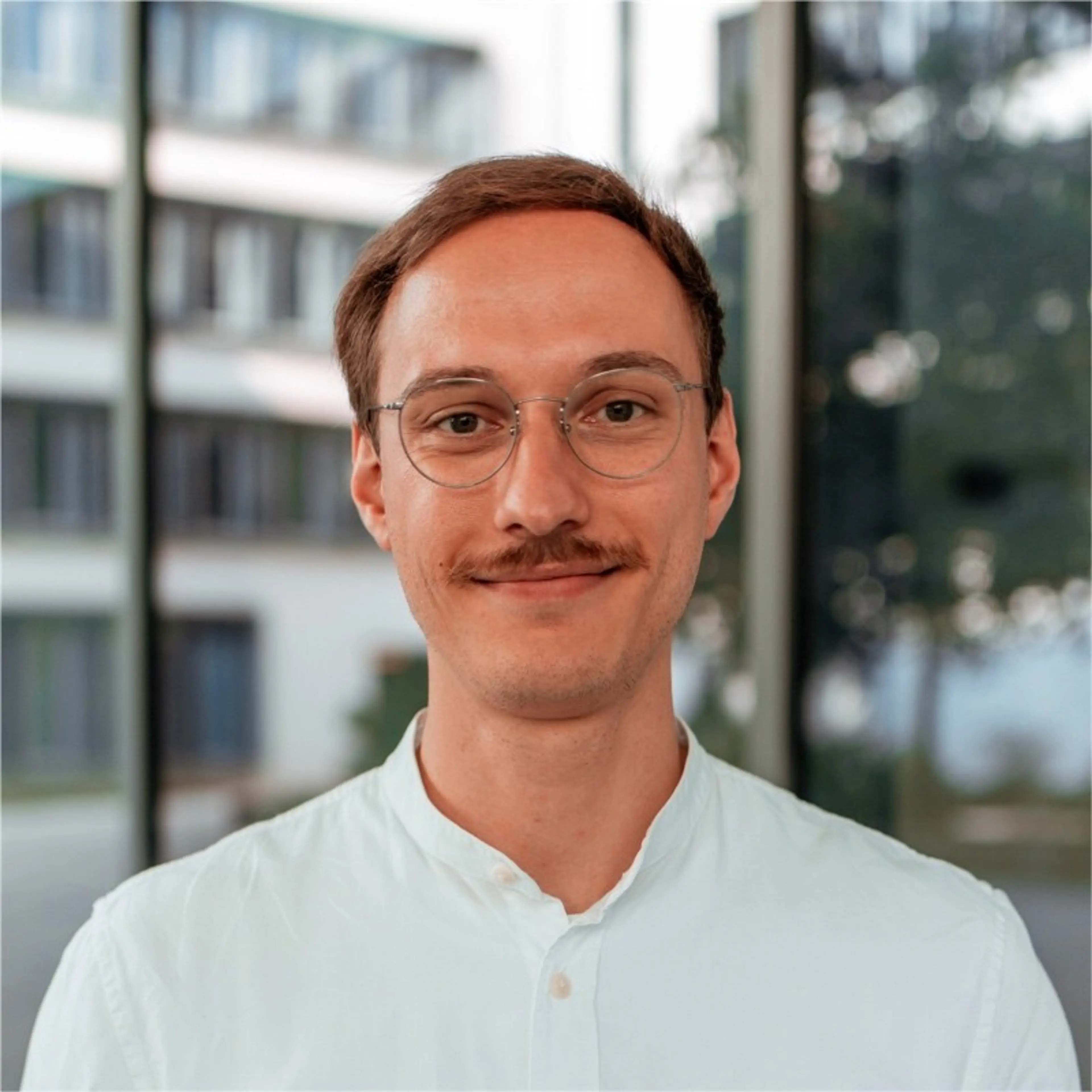 Smiling man with a white shirt