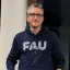 Middle aged white man with FAU hoodie 