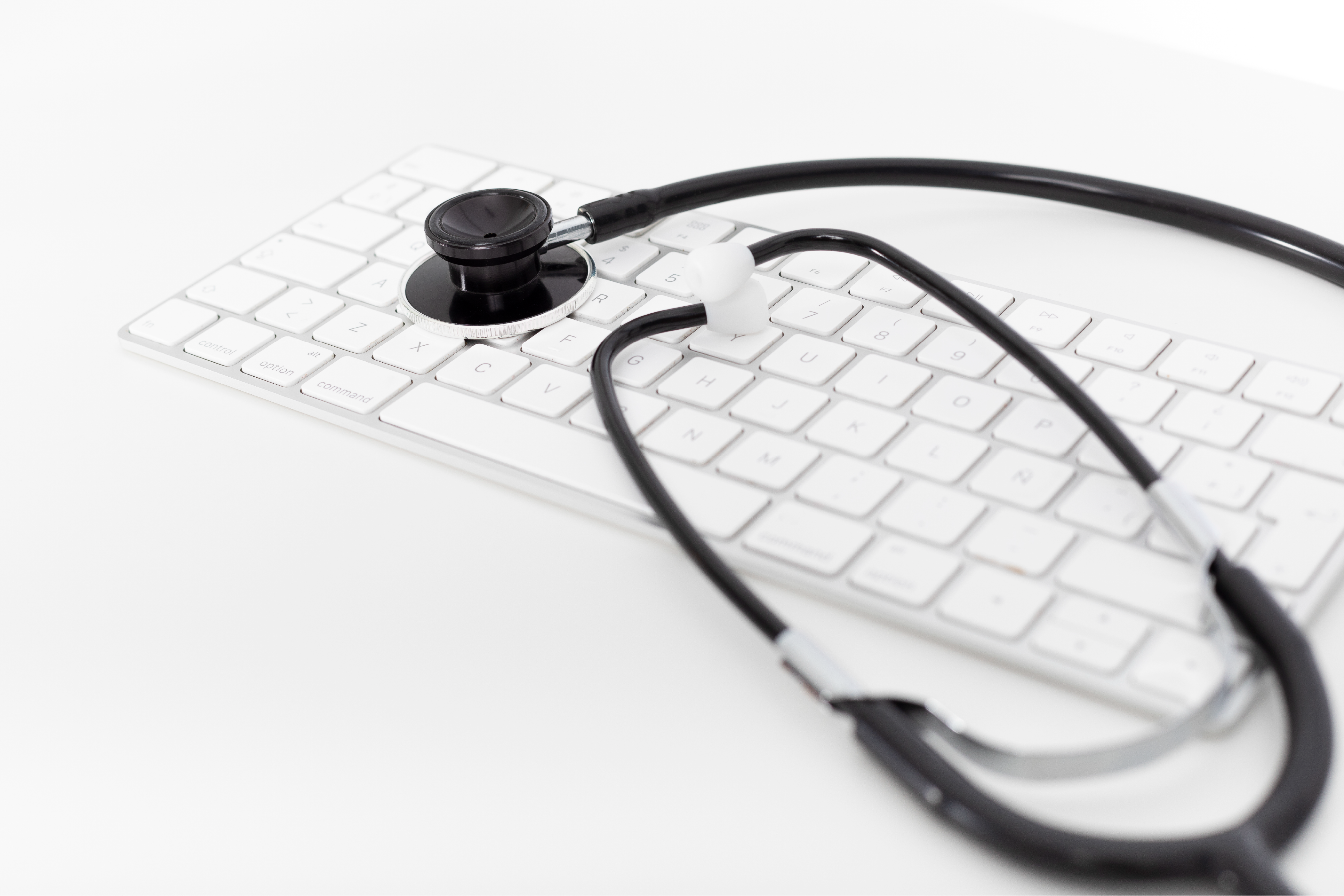 keyboard with healthcare item to symbolise digital transformation in the health sector