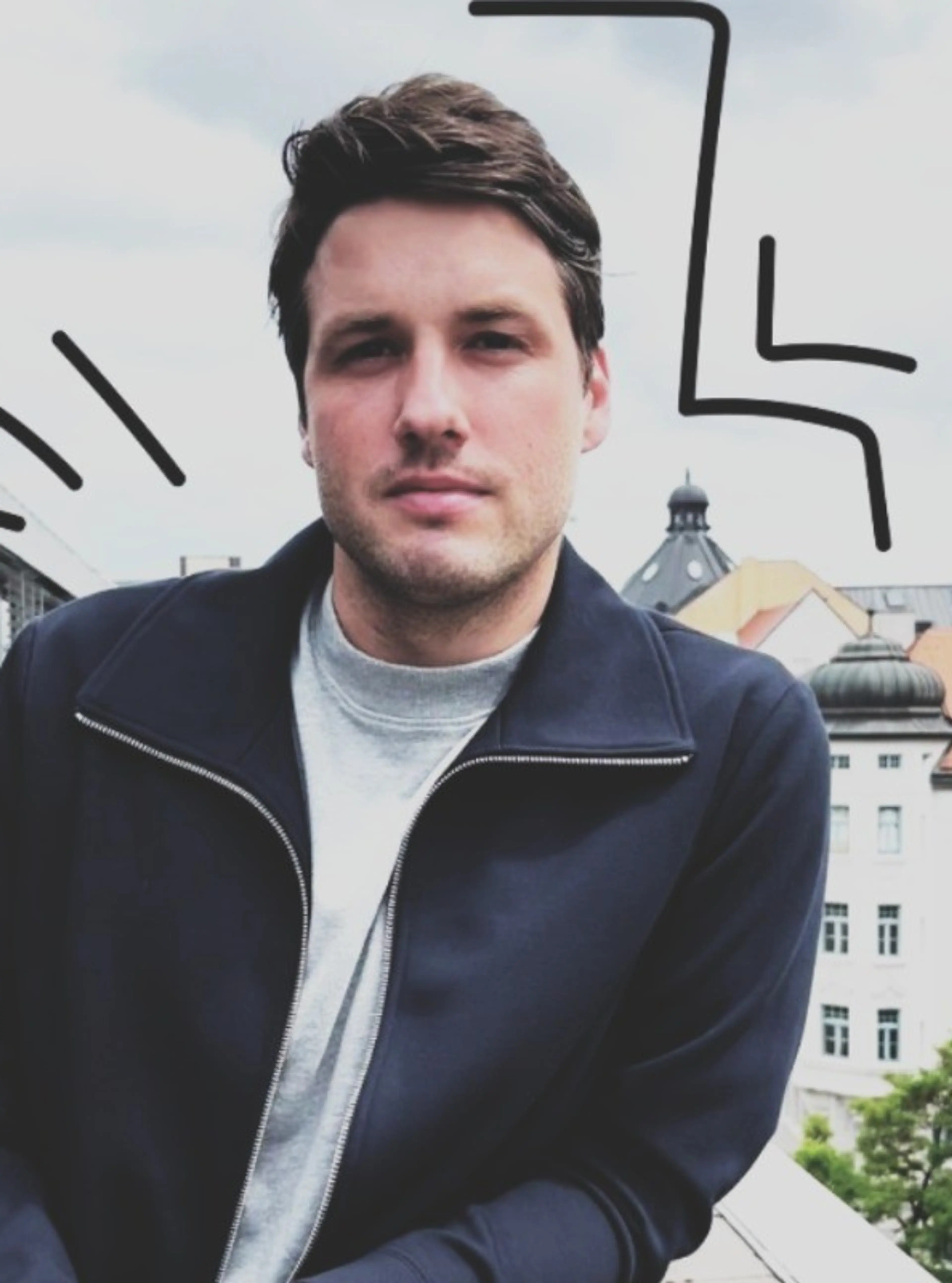 Smiling man leaning on balcony