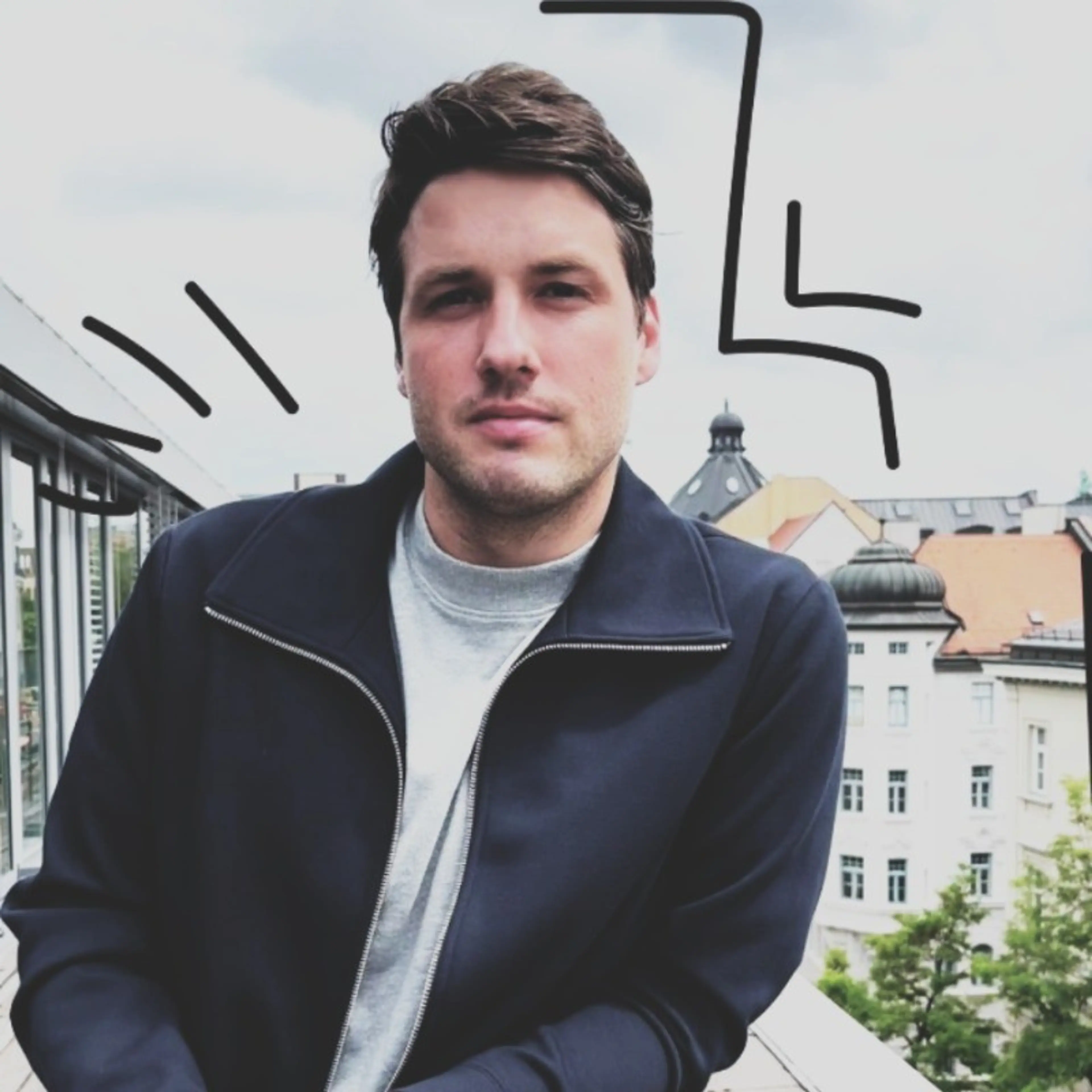 Smiling man leaning on balcony