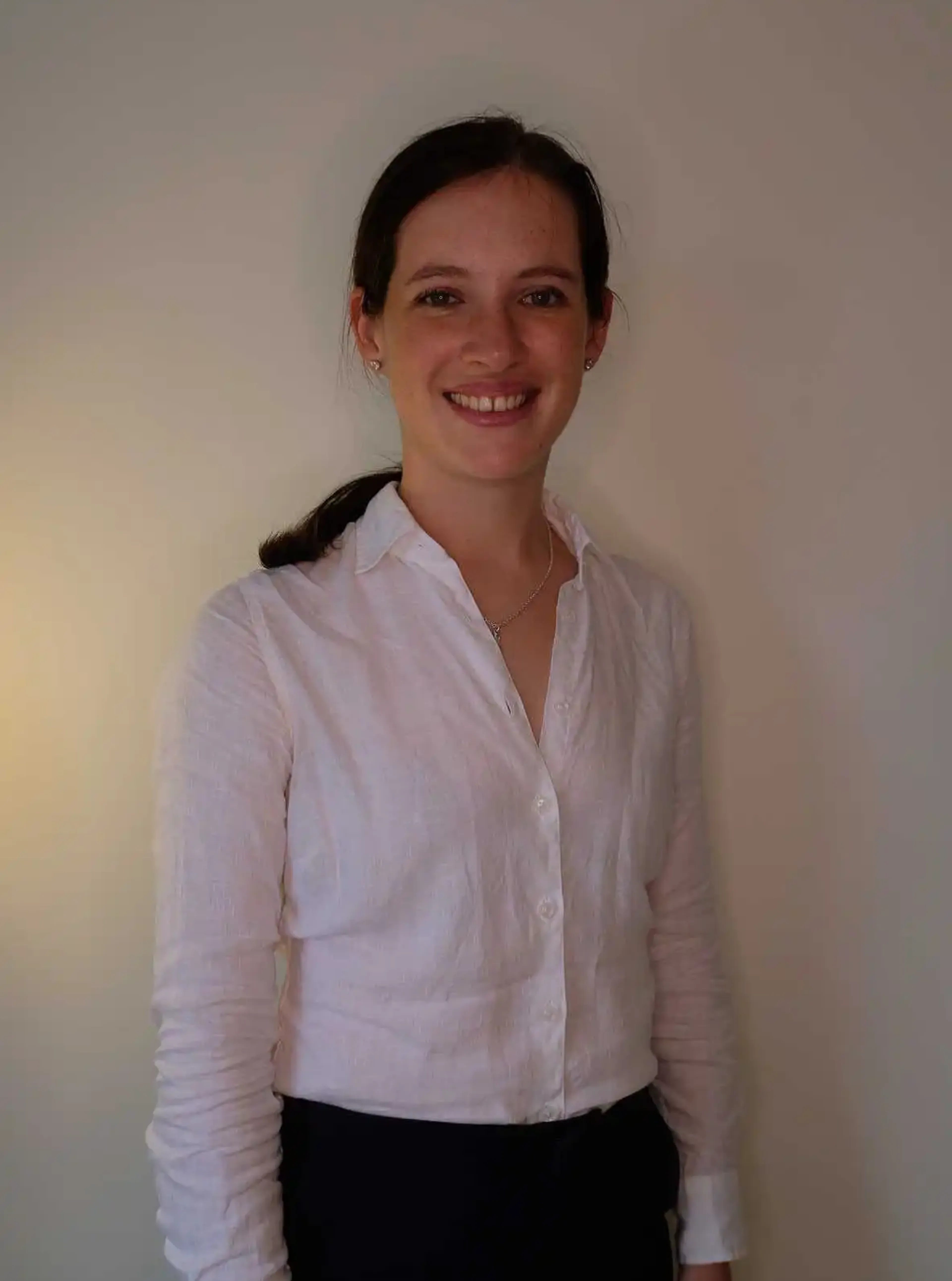 Smiling woman with a white shirt