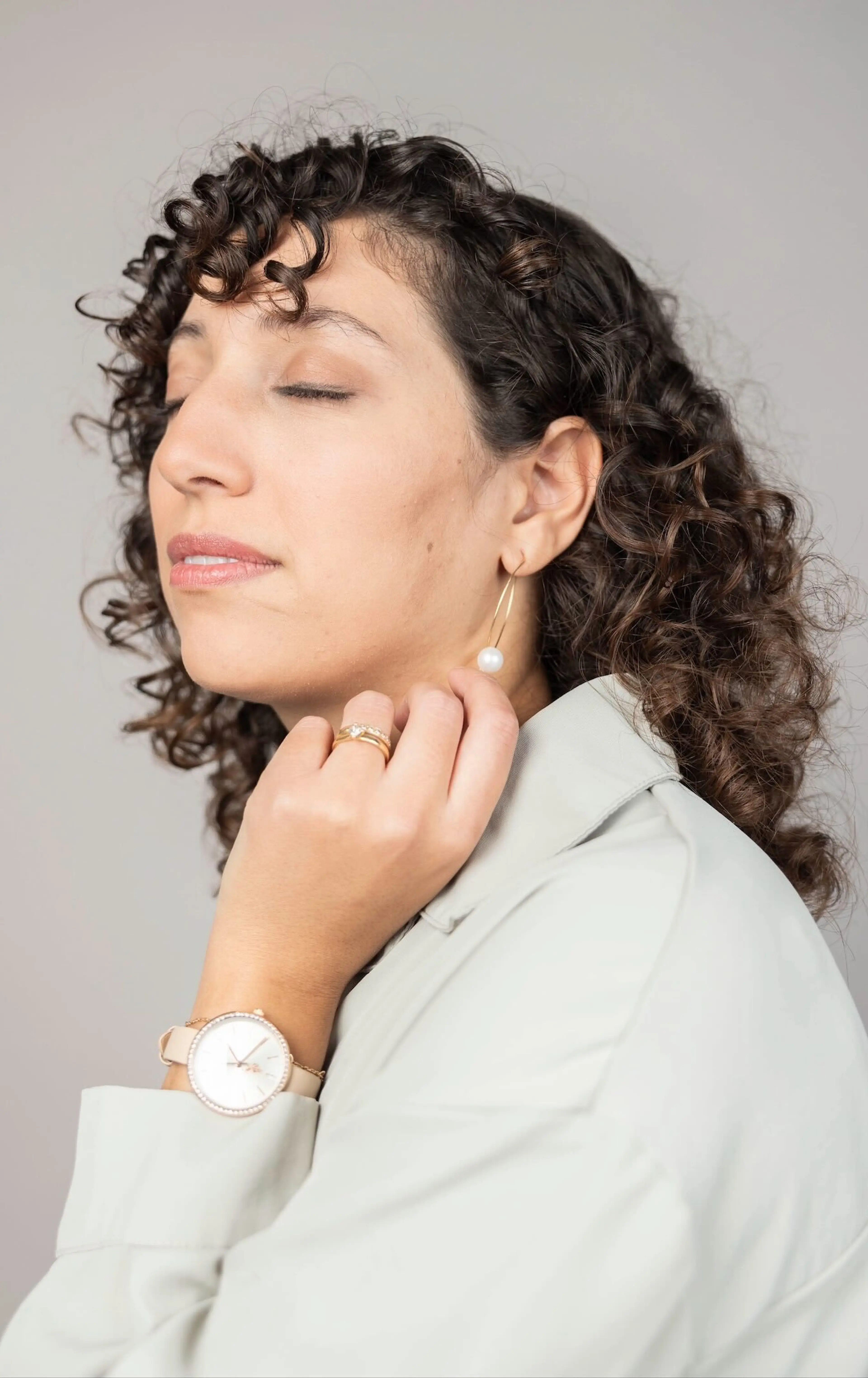 Woman with closed eyes facing left