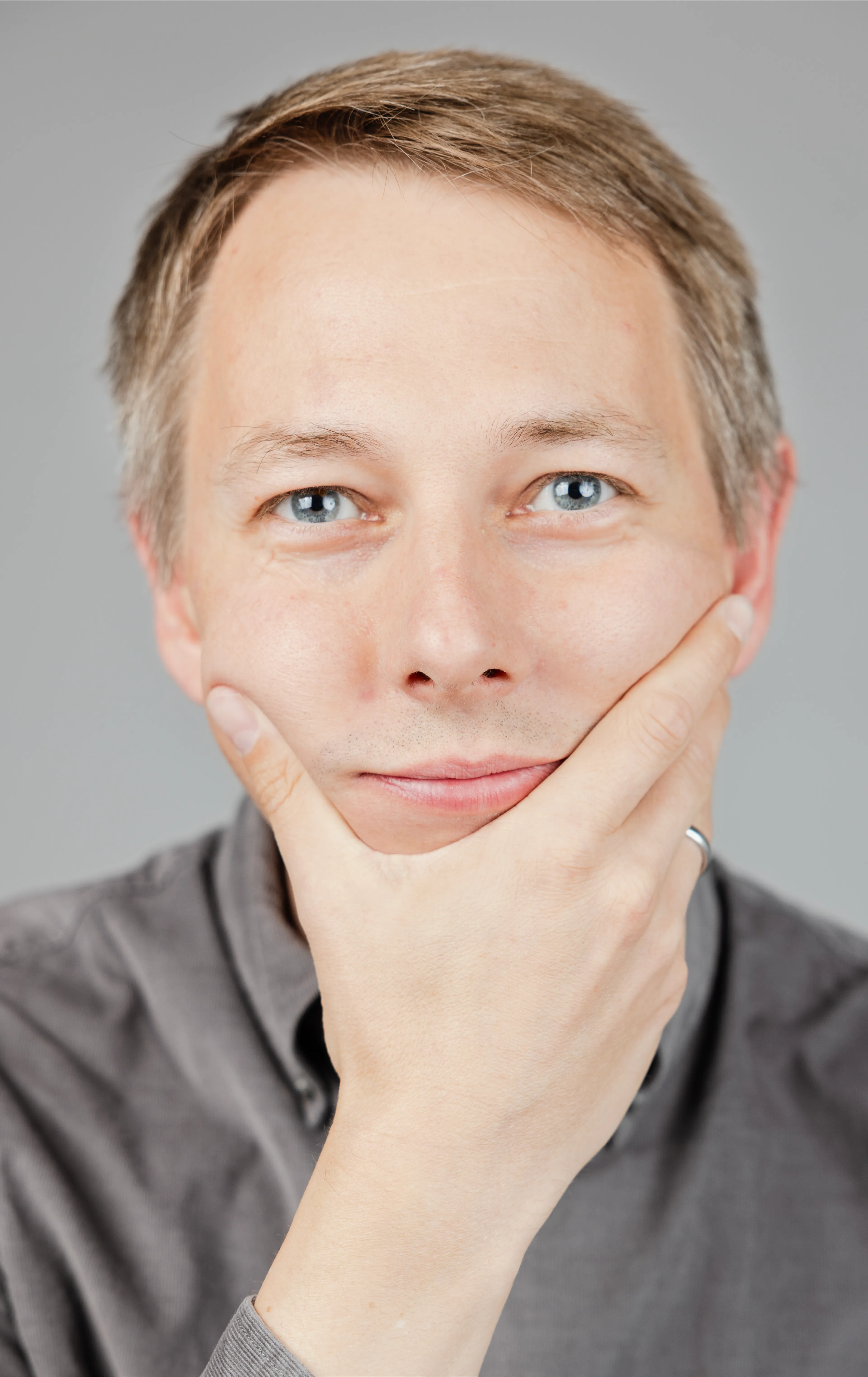 A man looking into the camera with a thoughtful pose