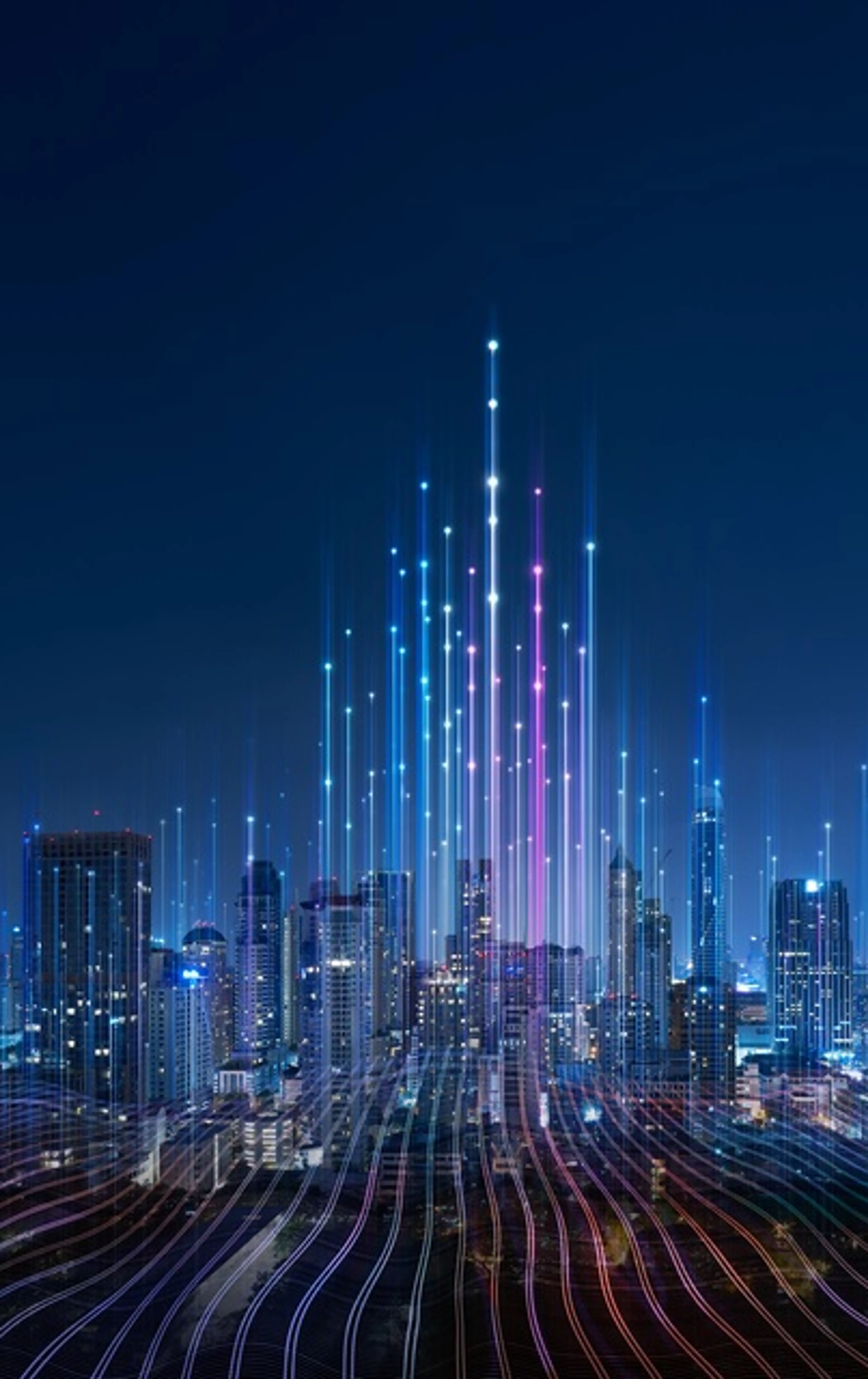 Futuristic cityscape at night with illuminated skyscrapers and digital data lines depicting connectivity and technological innovation."
