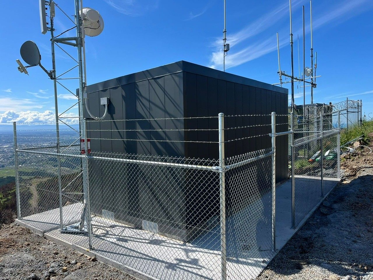 Galvanised security fencing with telecommunications equipment