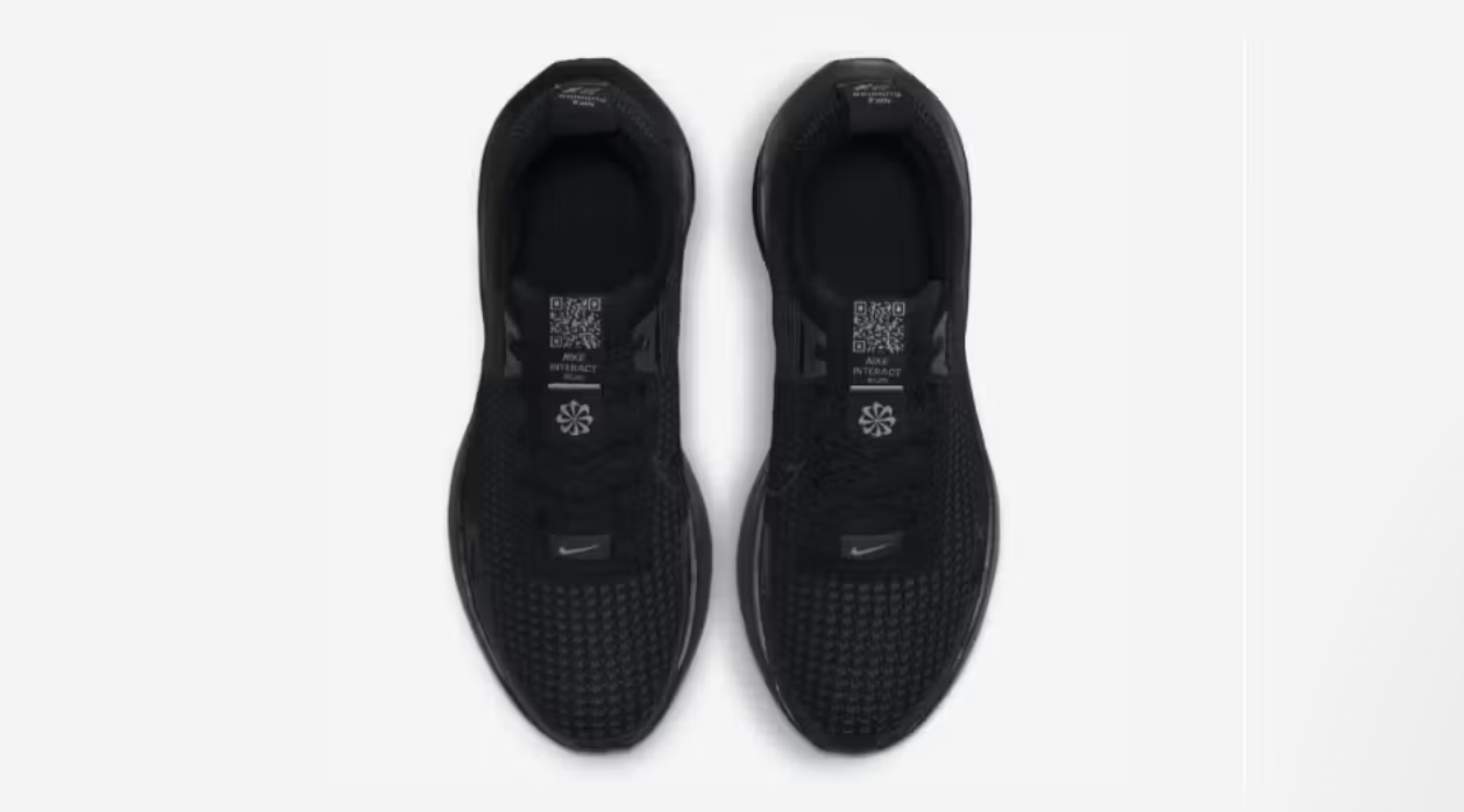 Nike Interact Run Black shoe with white QR code on tongue for sustainability info
