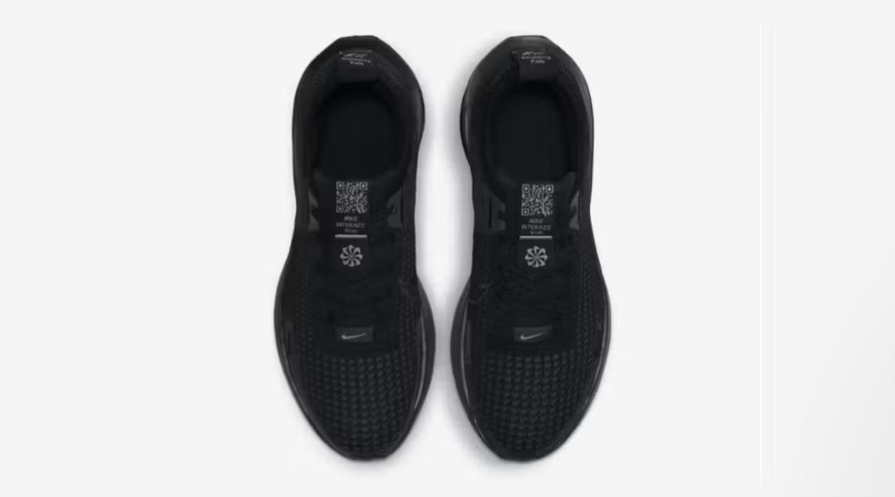 Nike Interact Run Black shoe with white QR code on tongue for sustainability info