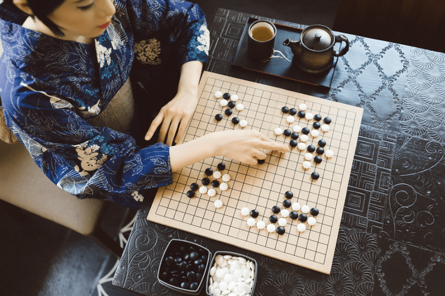 Women playing Japanese board game