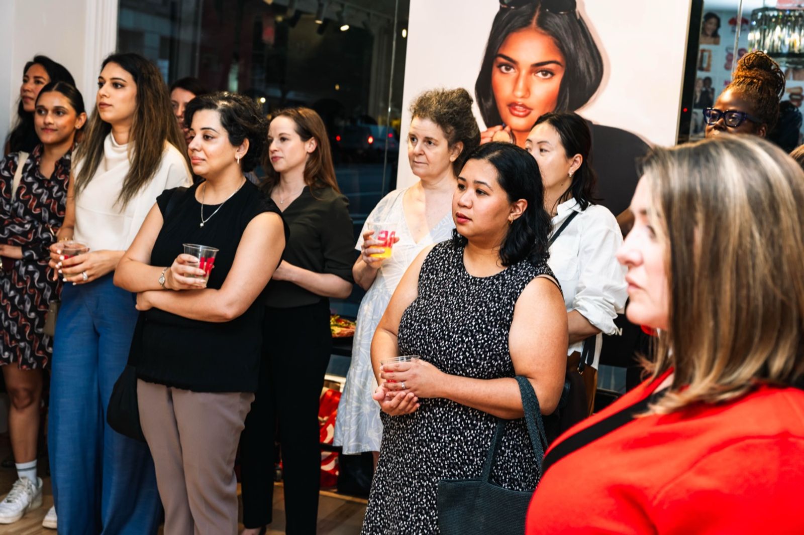 Members gathered in the store listening to Jeanelle