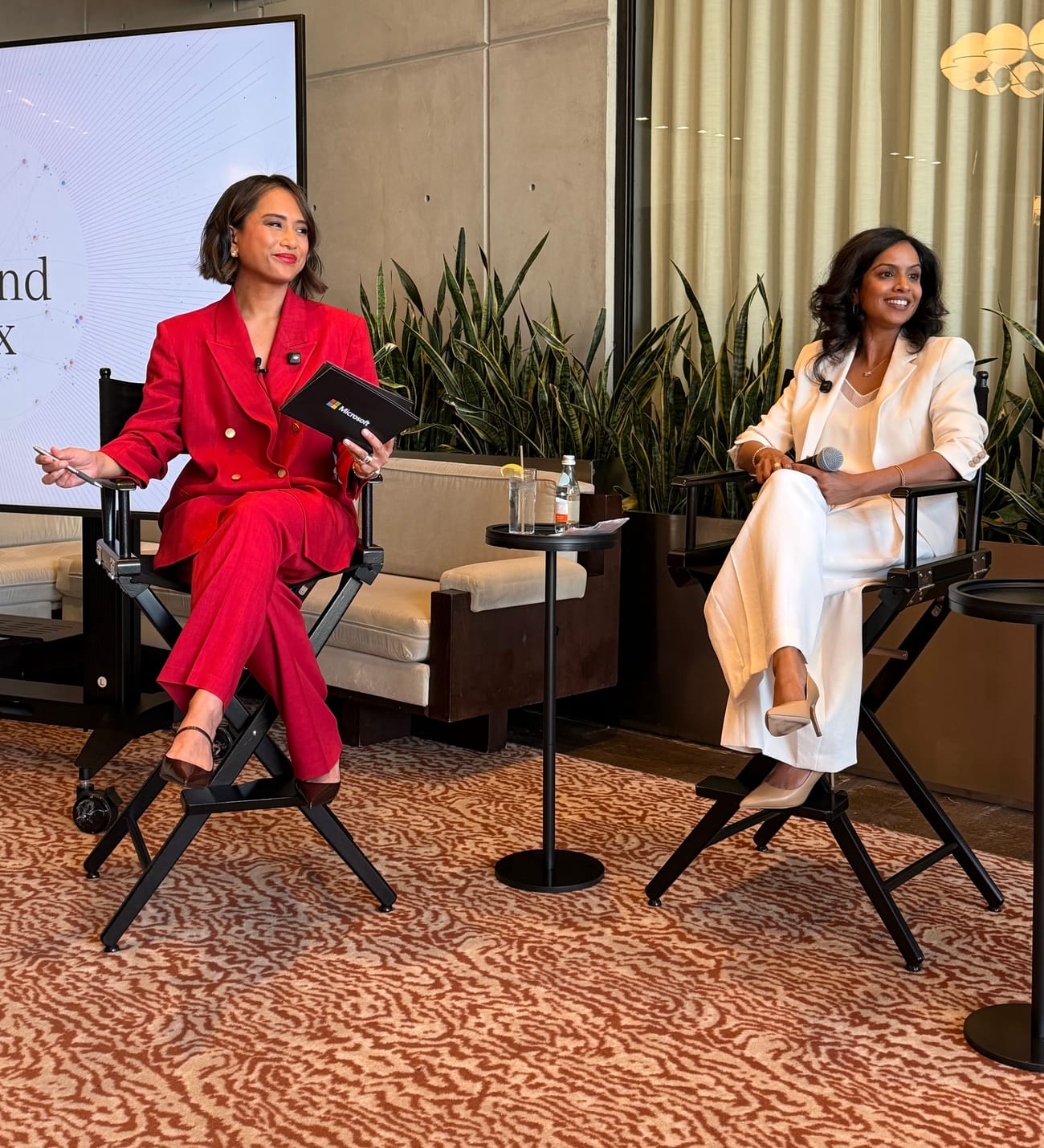 Jeanelle on stage with a panelist at the Work Trend Index launch