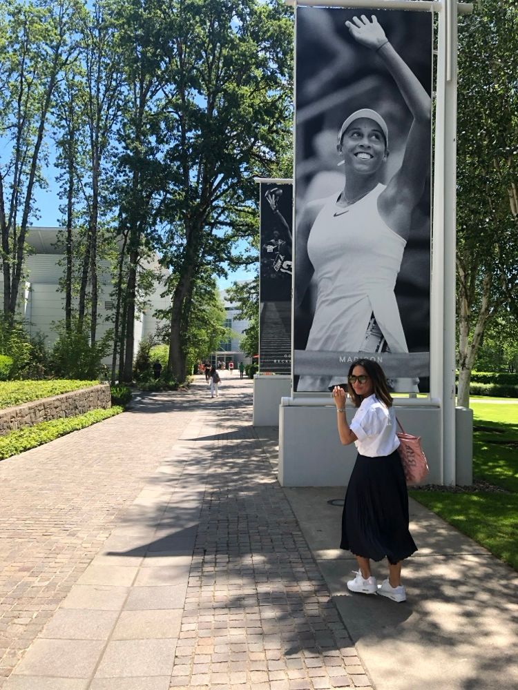 Jeanelle on the Nike campus beneath a Serena Williams poster