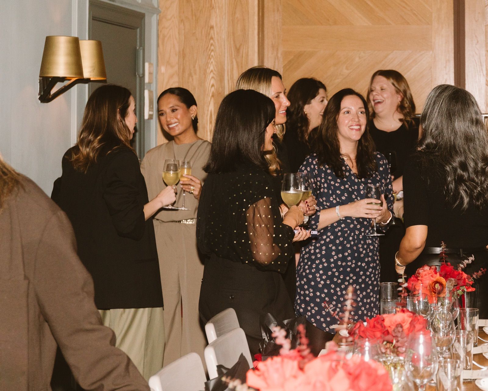 Guests with glasses of wine before dinner