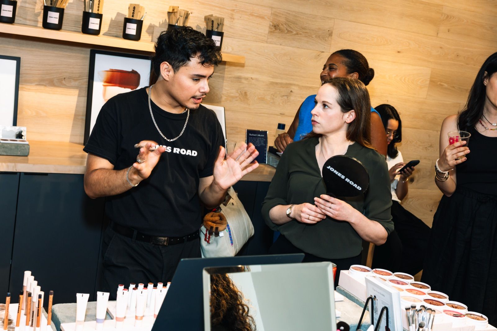 A Jones Road artist talking members through the products