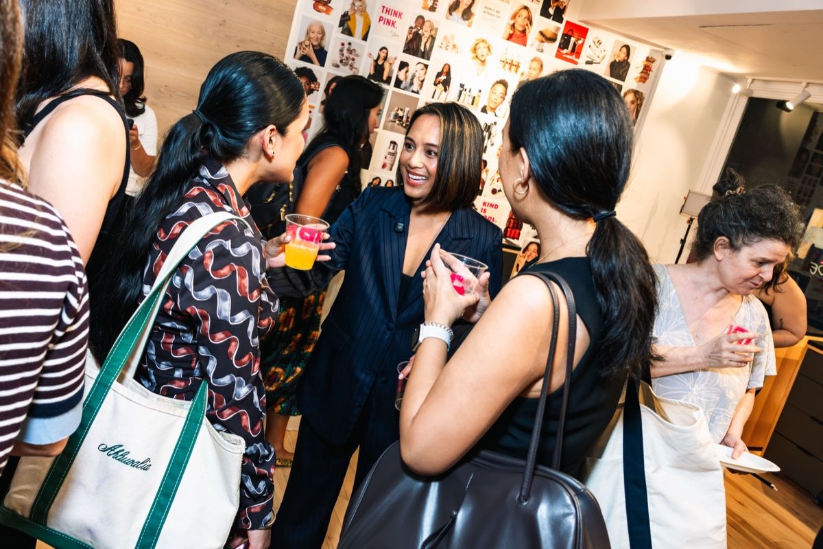 Jeanelle with guests at a Work Lunch event