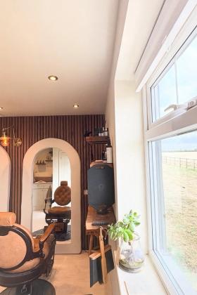Looking through the studio from the window, towards the arched mirror