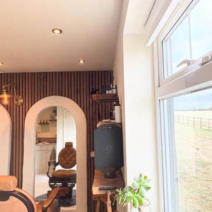 Looking through the studio from the window, towards the arched mirror
