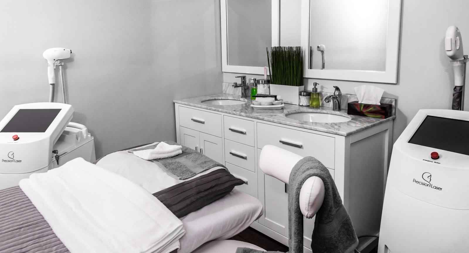 Aesthetic clinic treatment room with skincare and laser equipment