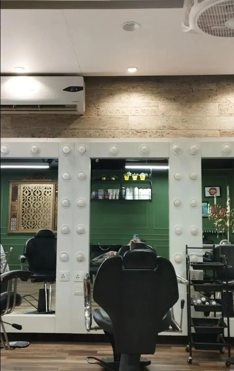 Interior of Beautylicious The Salon in DHA Lahore with lit vanity mirrors and styling chairs