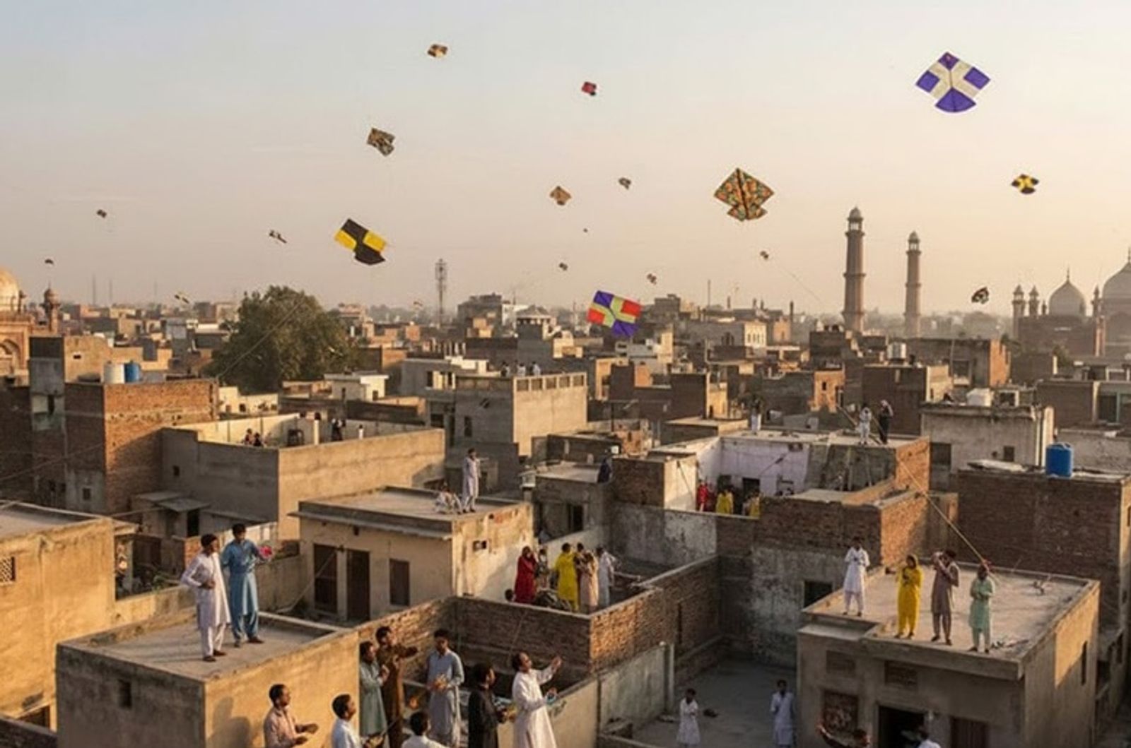 People flying kites on Basant in Walled city, Lahore