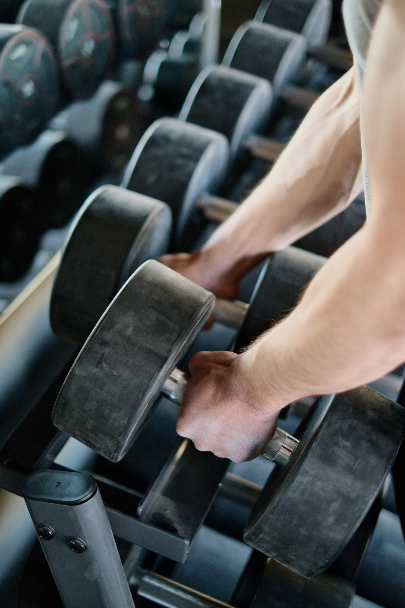 Rows of dumbbells and weights in a gym