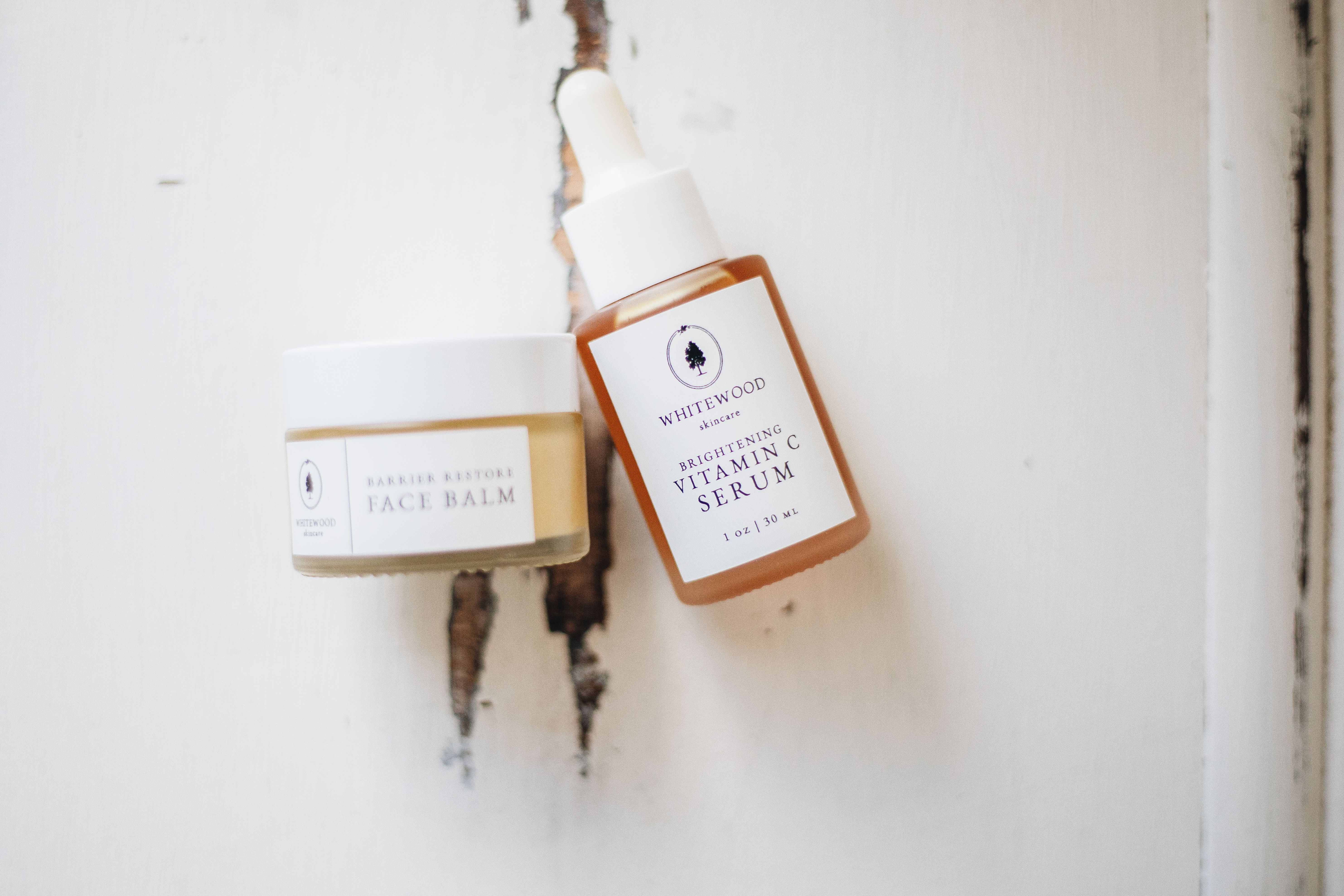 Flat lay of skincare serums and facial products arranged on a neutral surface