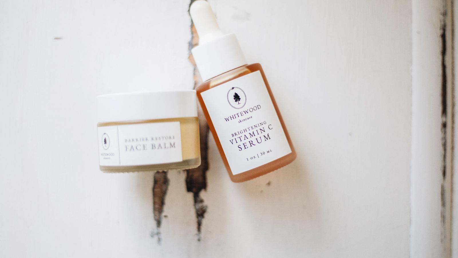Flat lay of skincare serums and facial products arranged on a neutral surface