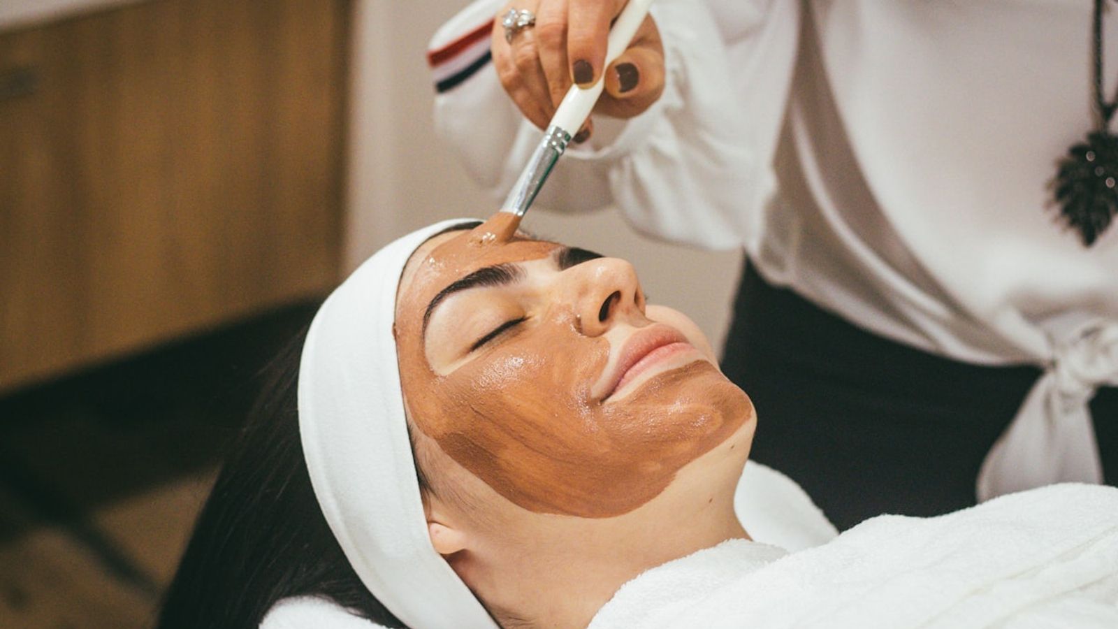 Aesthetic skincare clinic treatment setup for facial laser procedure