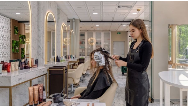 Customer taking service of hair color salon