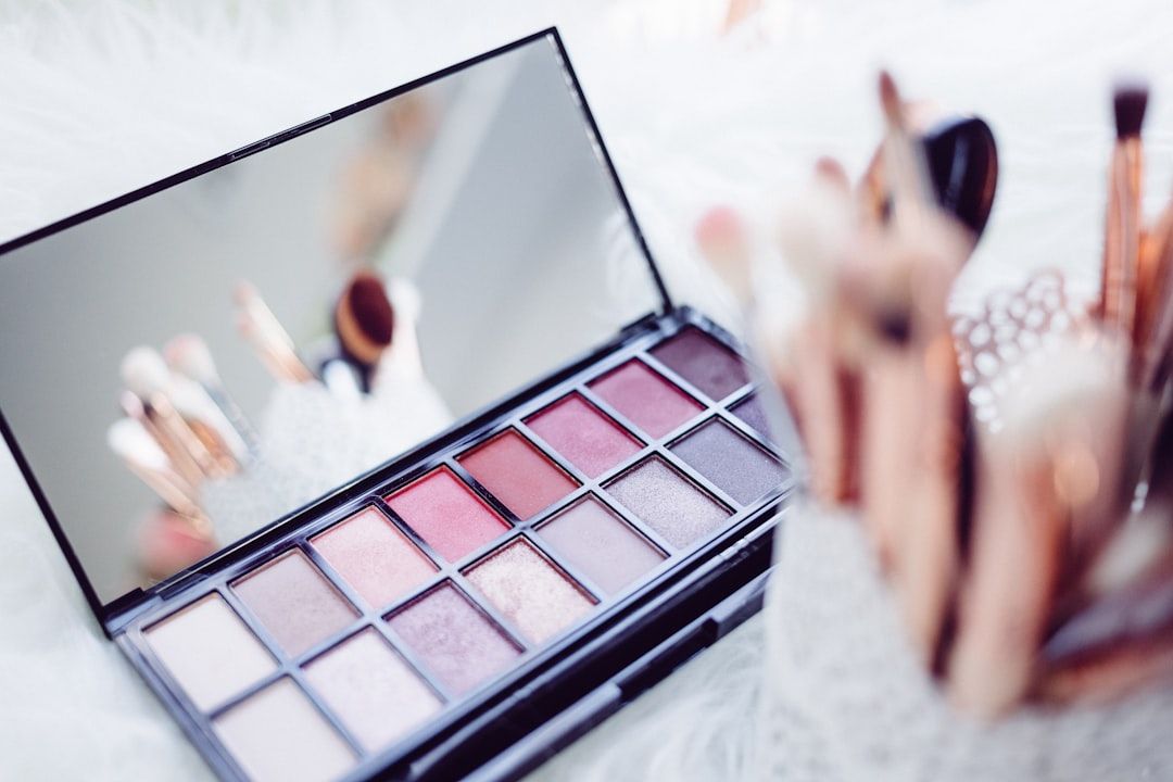 Professional eyeshadow palette and cosmetic tools in a beauty studio