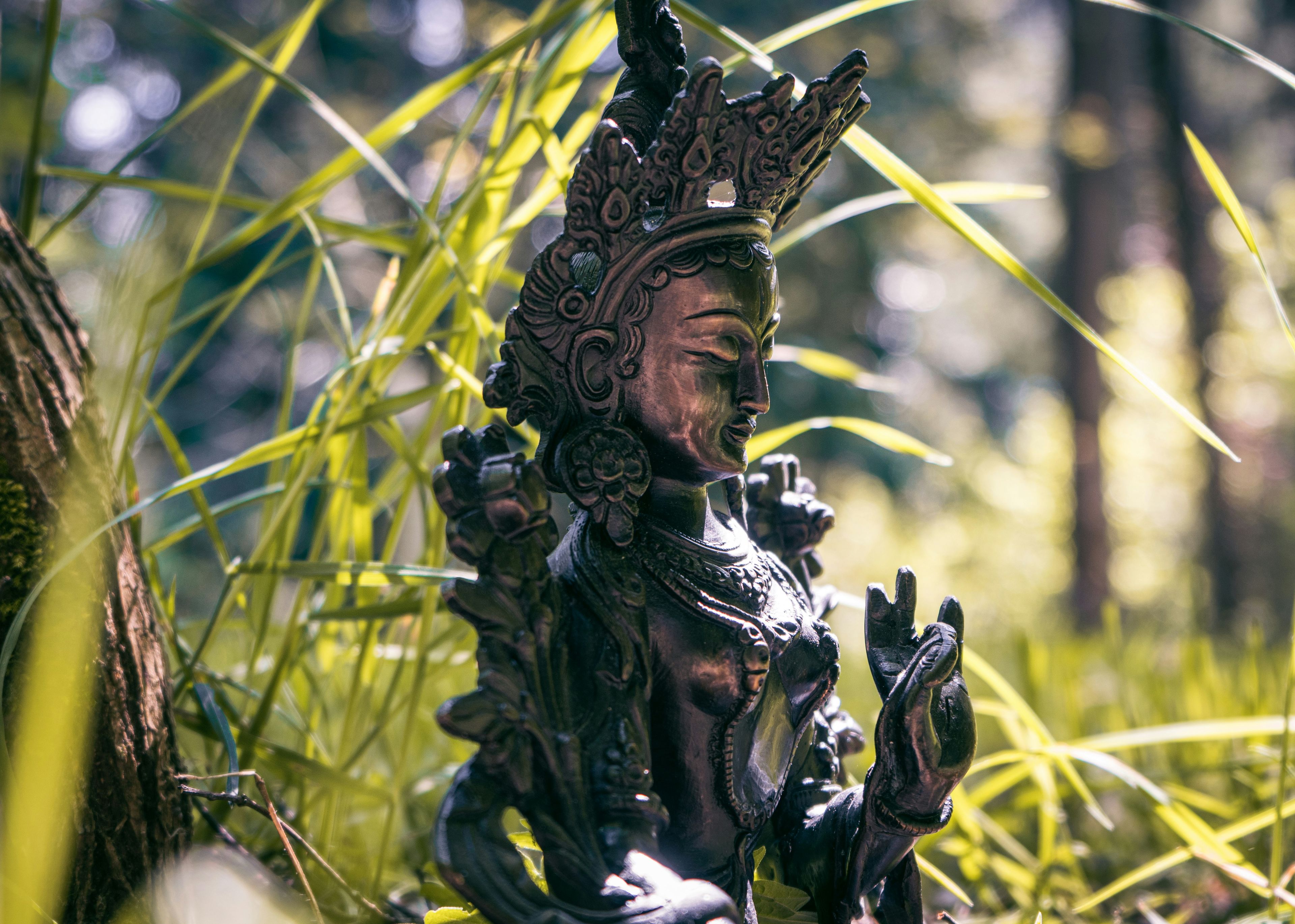 gold and black hindu deity figurine