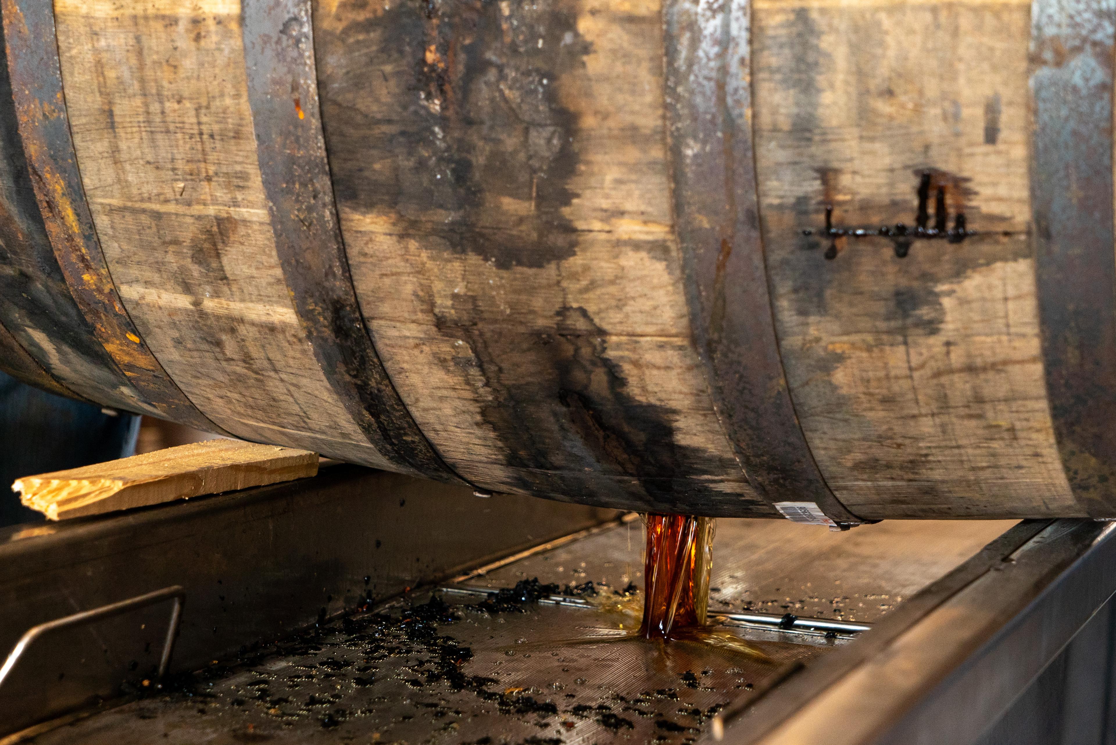 Whiskey barrel being dumped