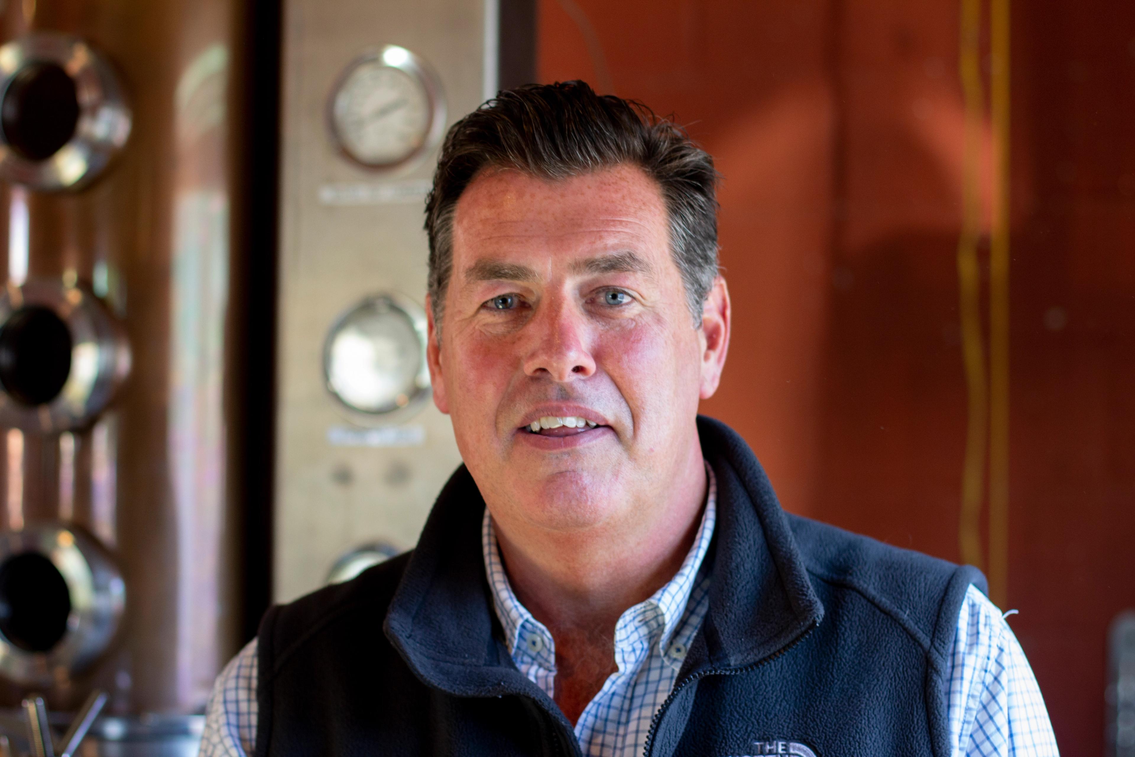 Paul McLaughlin in front of a still