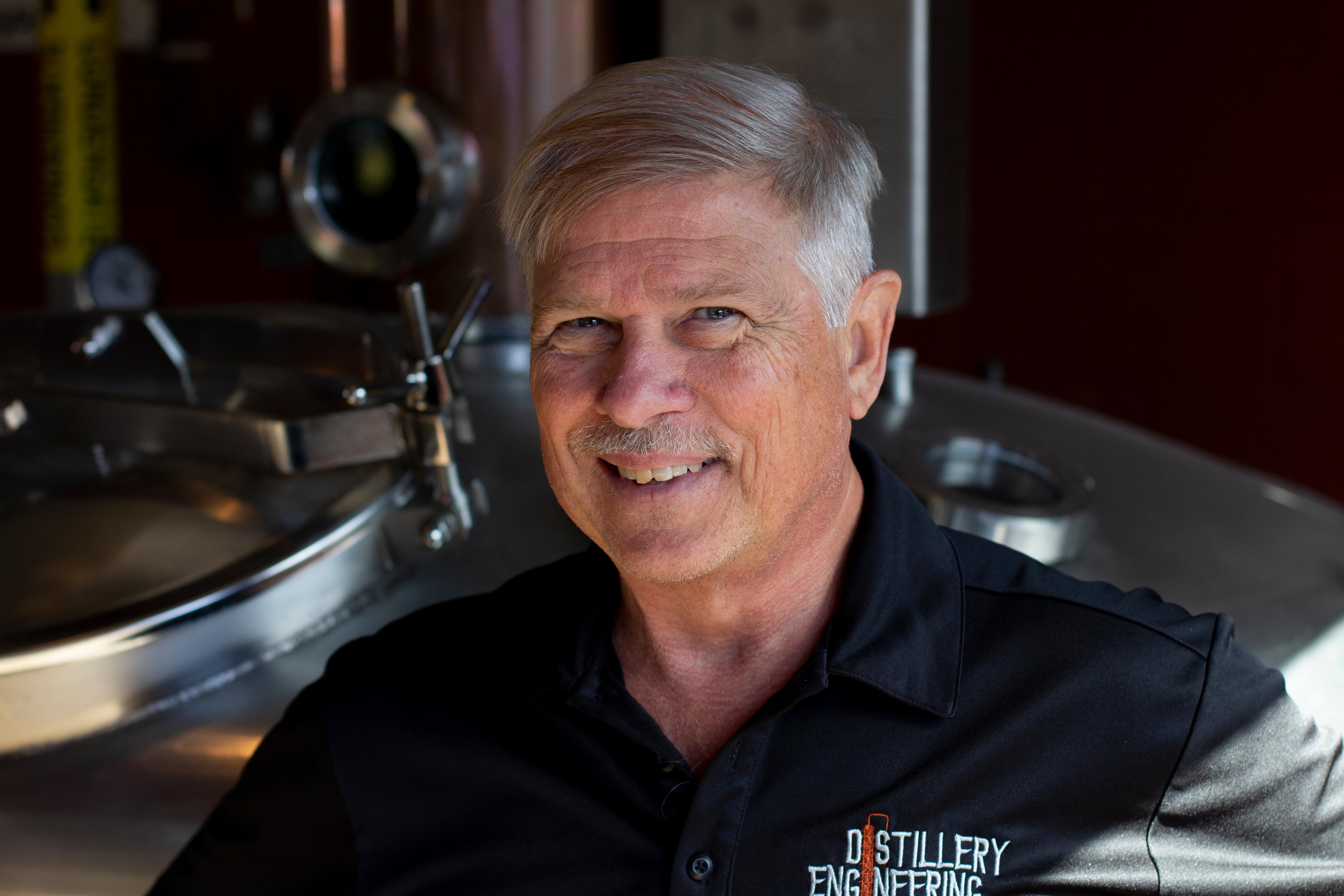 Pete Kamer in front of a still