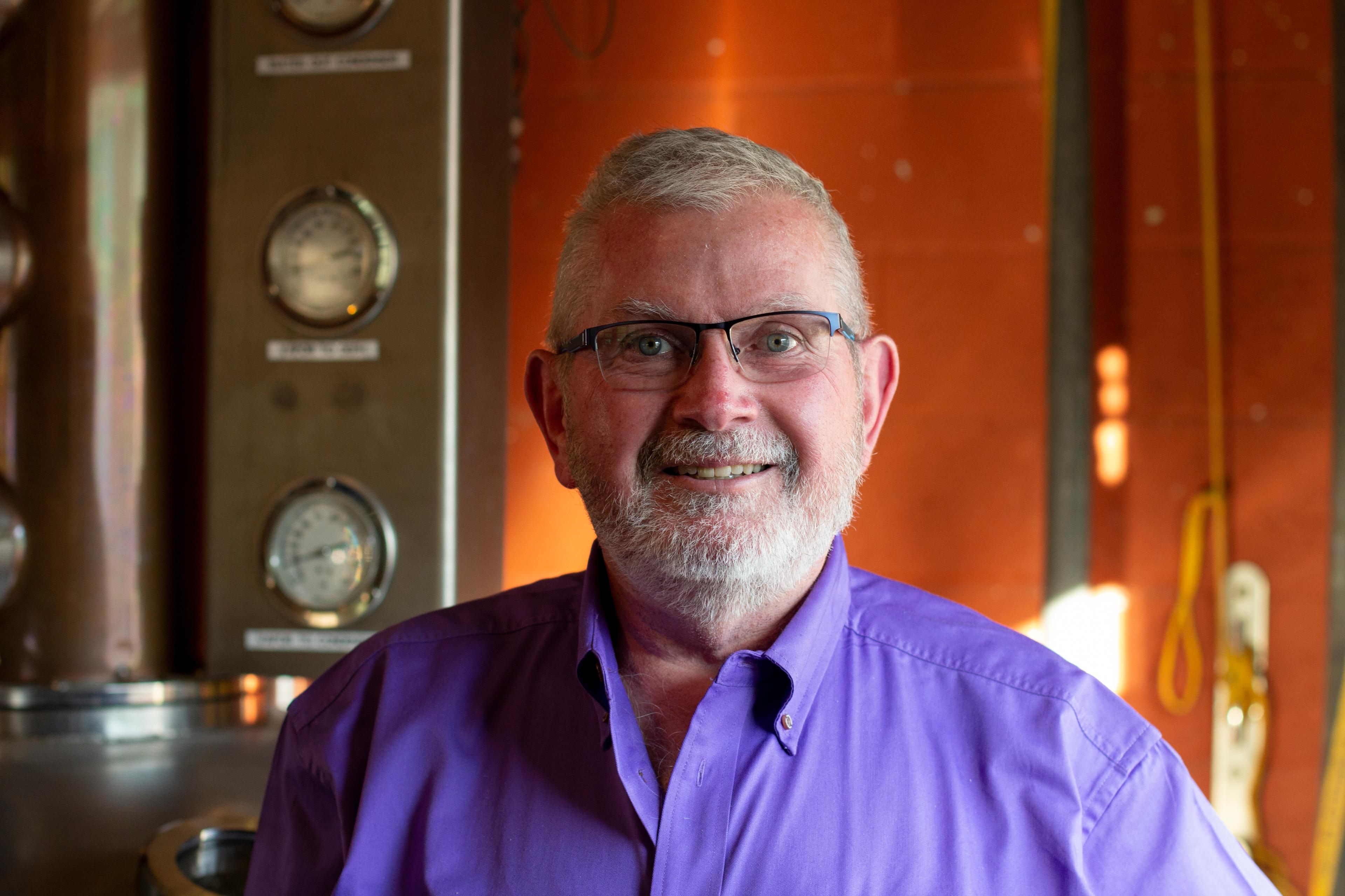 Chris Zaborowski in front of still