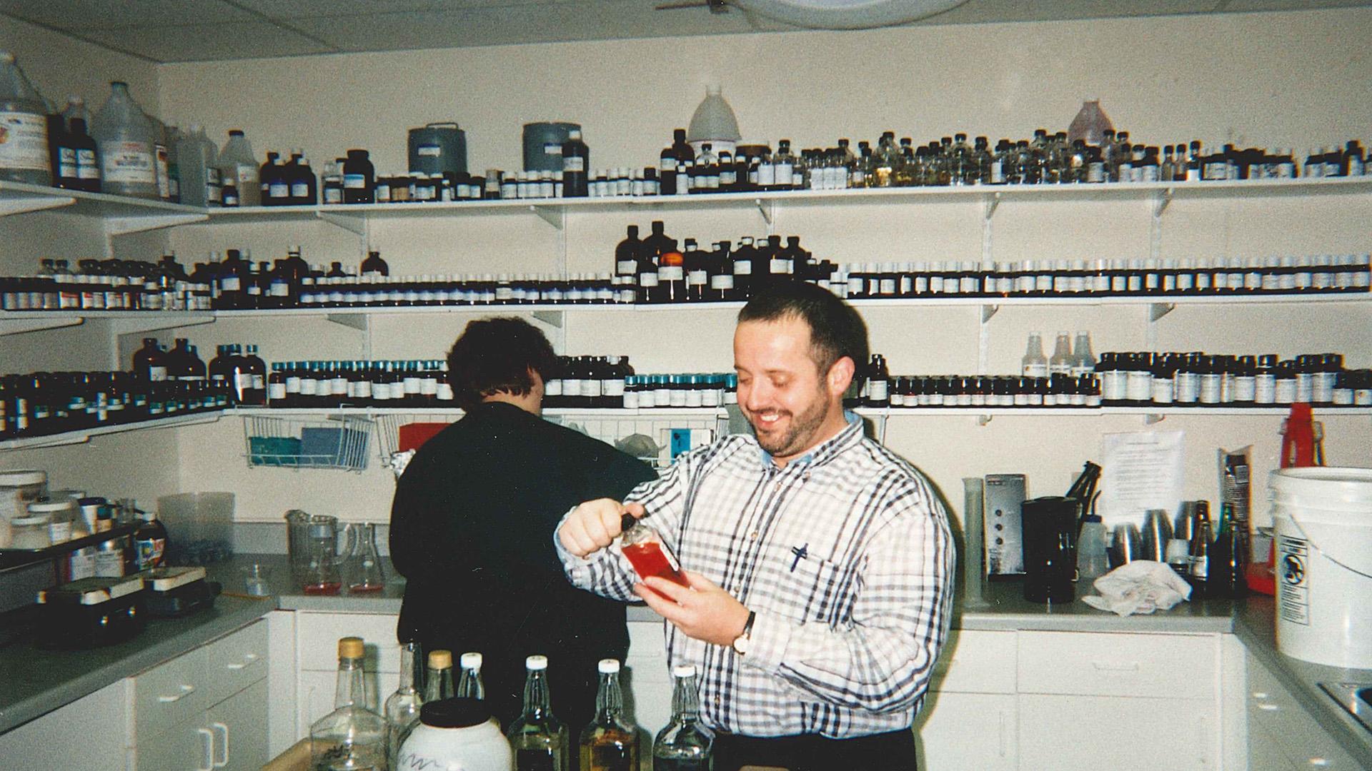Dave examining a bottle in the lab