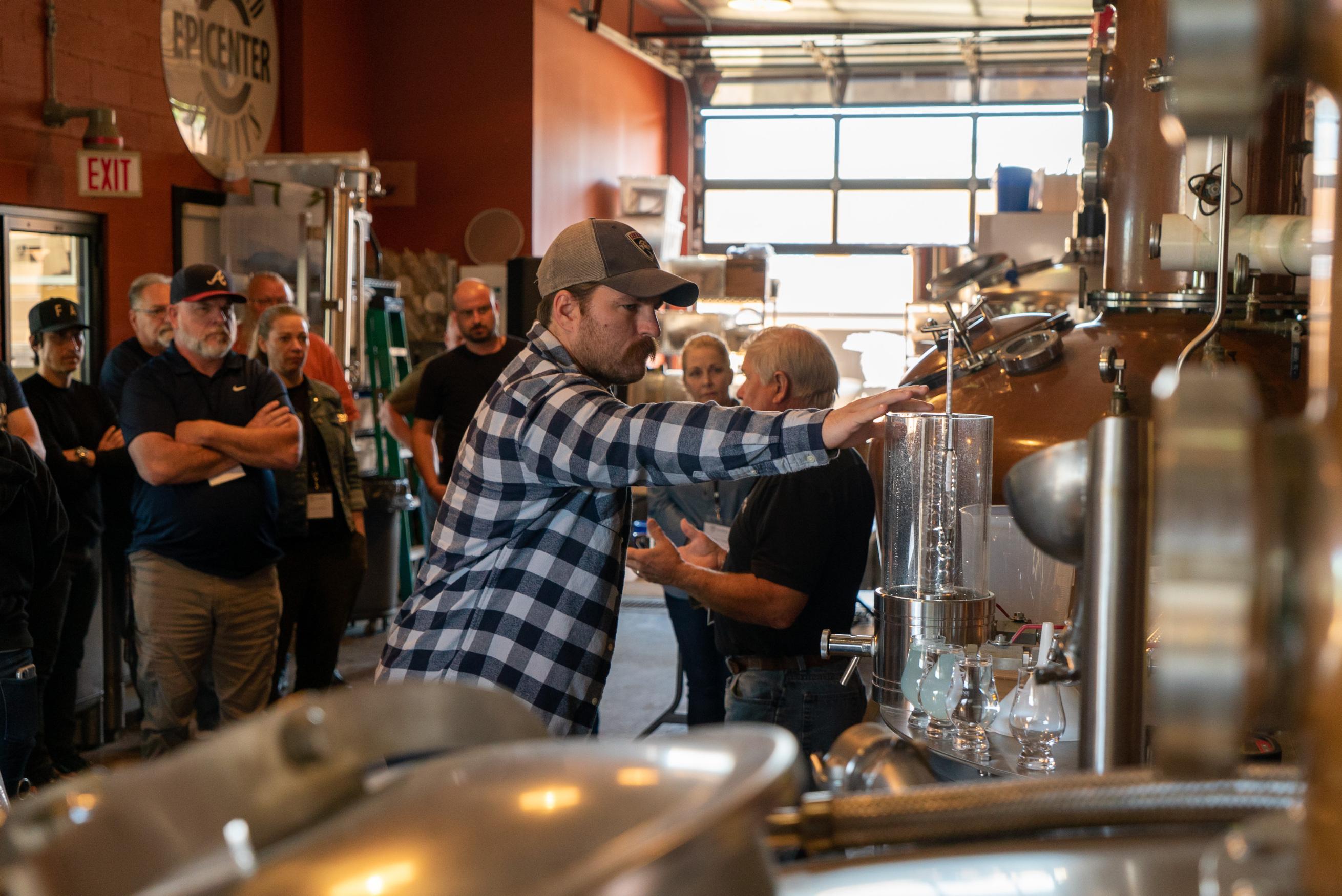 People watching distillery demonstration