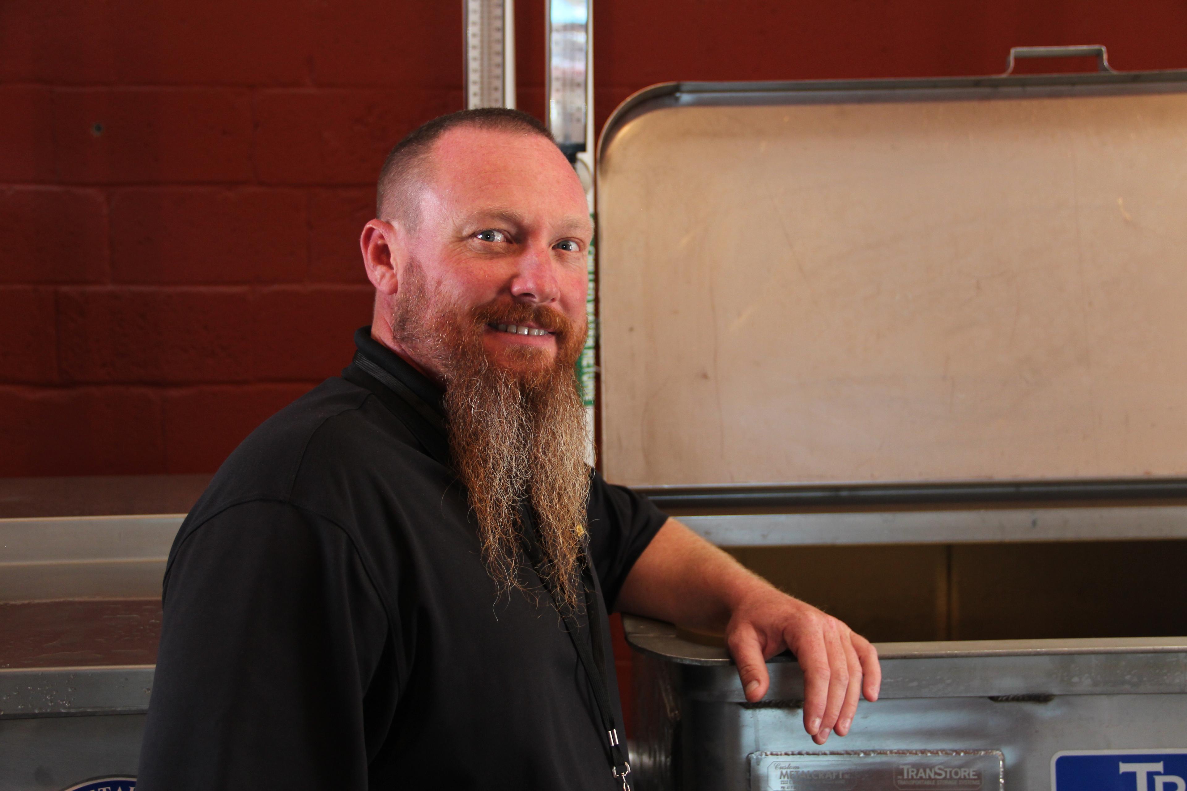 Patrick Heist in front of a fermenter
