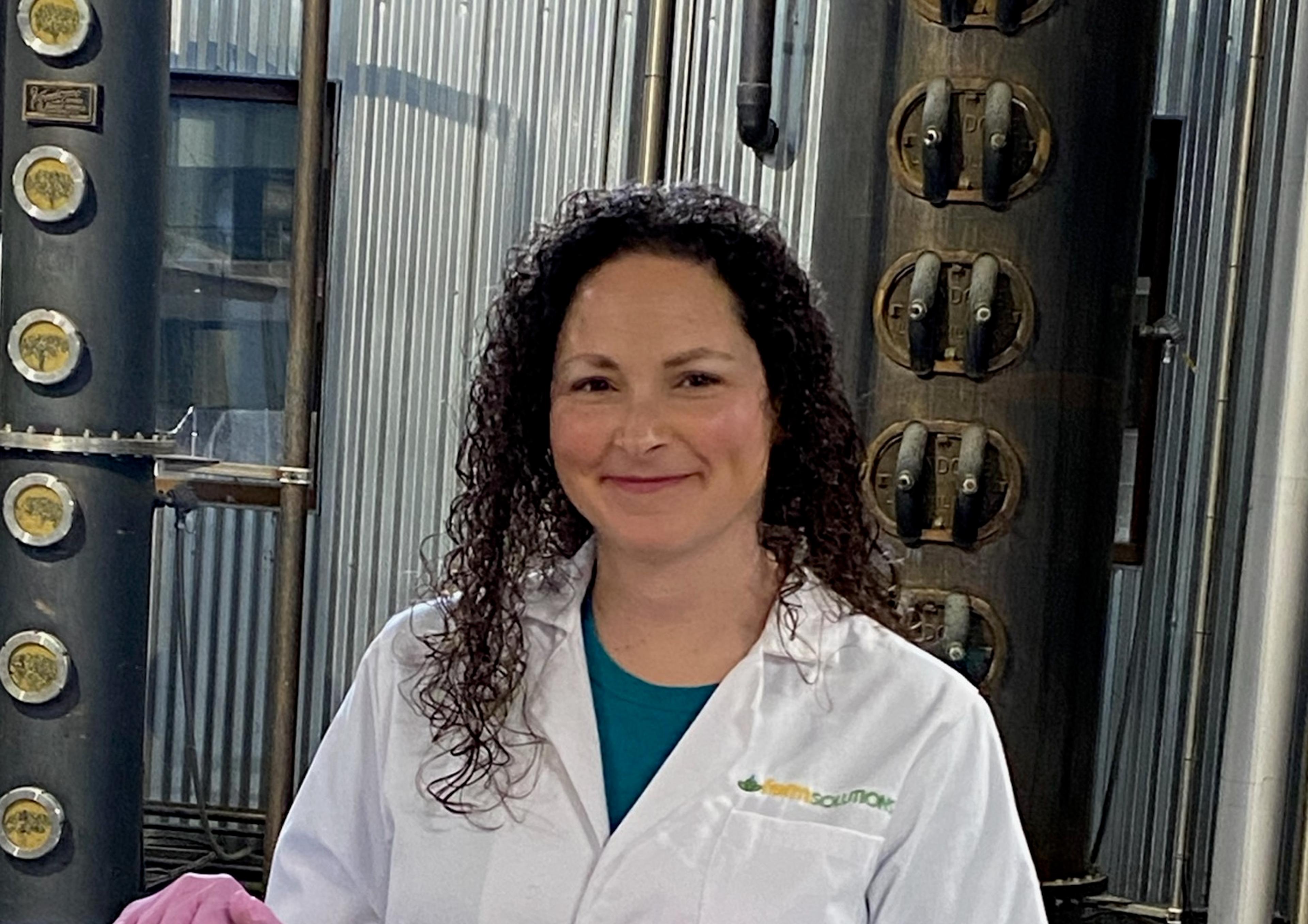 Melanie Heist next to fermenter