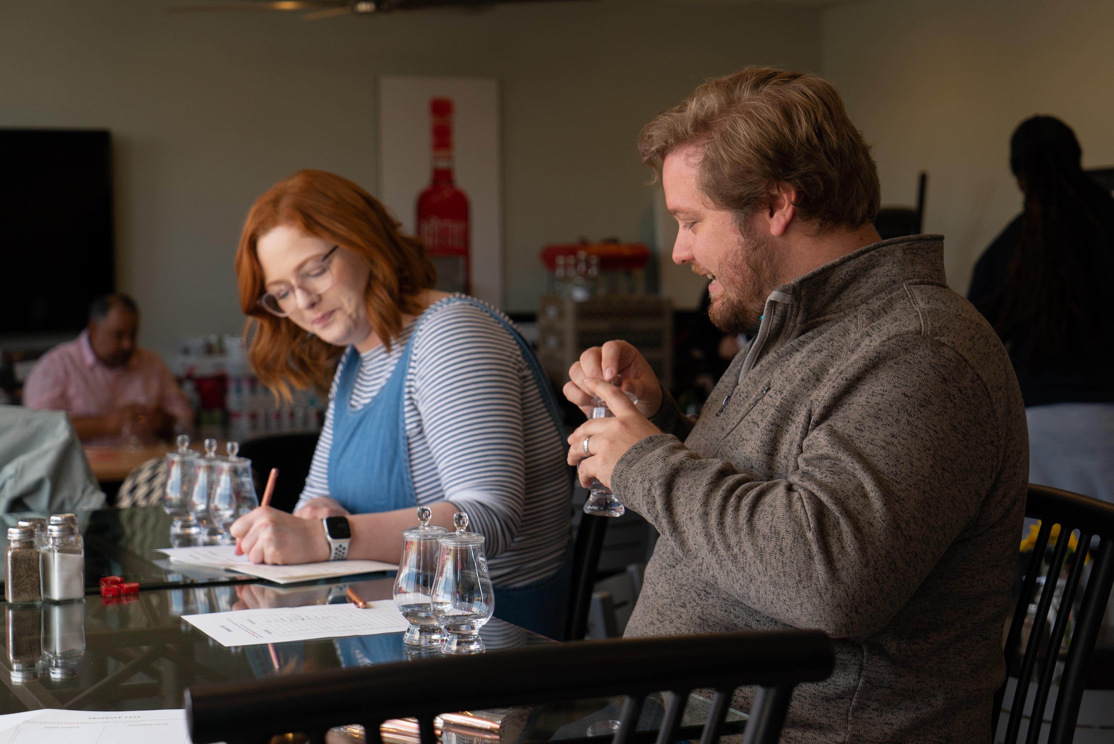 two people discussing spirits in classroom